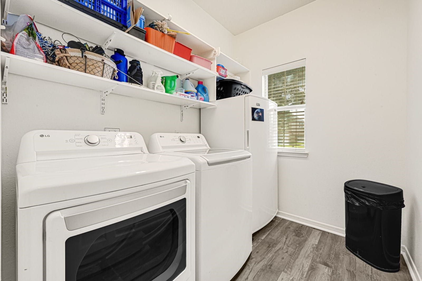 3422 Bay Breeze Drive, Seabrook, TX 77586 Laundry room with shelving and extra storage