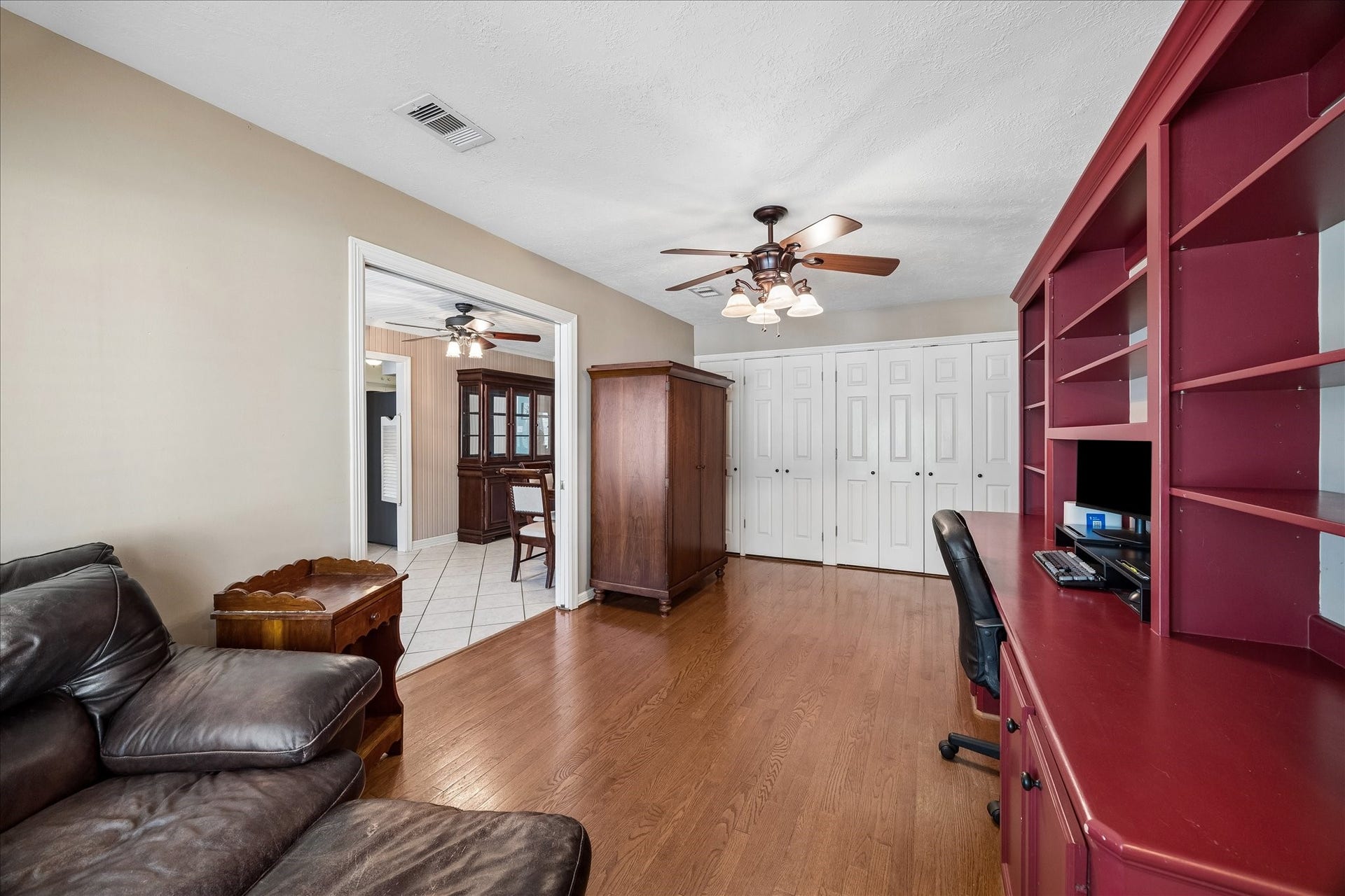 1611 Gardenia Drive, Houston, TX 77018 A wall of closets provides storage in the dedicated office for the washer, dryer and extra refrigerator, keeping work essentials and household items neatly tucked away. Its wide opening to the dining room keeps the space connected while maintaining a distinct purpose.