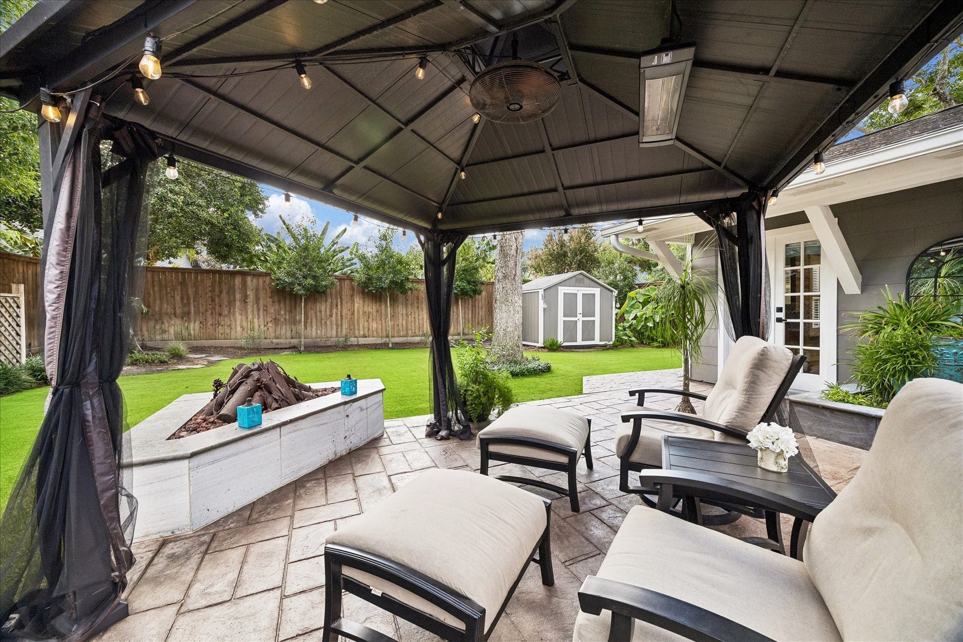 1611 Gardenia Drive, Houston, TX 77018 Designed for year round enjoyment, the gazebo features a ceiling fan, overhead heater and string lighting, all positioned beside the built in fire pit.