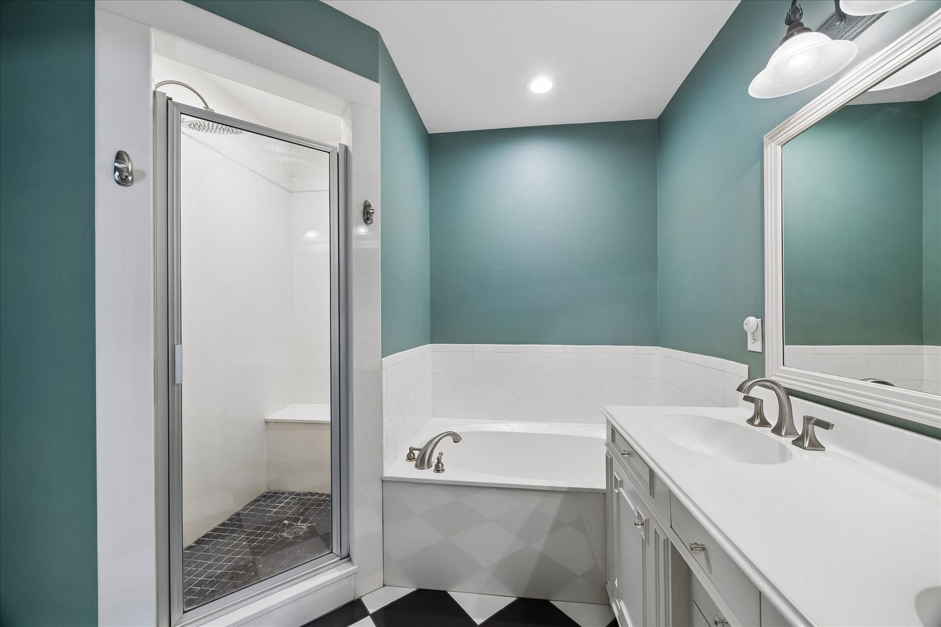 1611 Gardenia Drive, Houston, TX 77018 Primary bath includes a double vanity with generous storage, soaking tub and separate walk in shower, creating a well appointed retreat just off the primary suite.