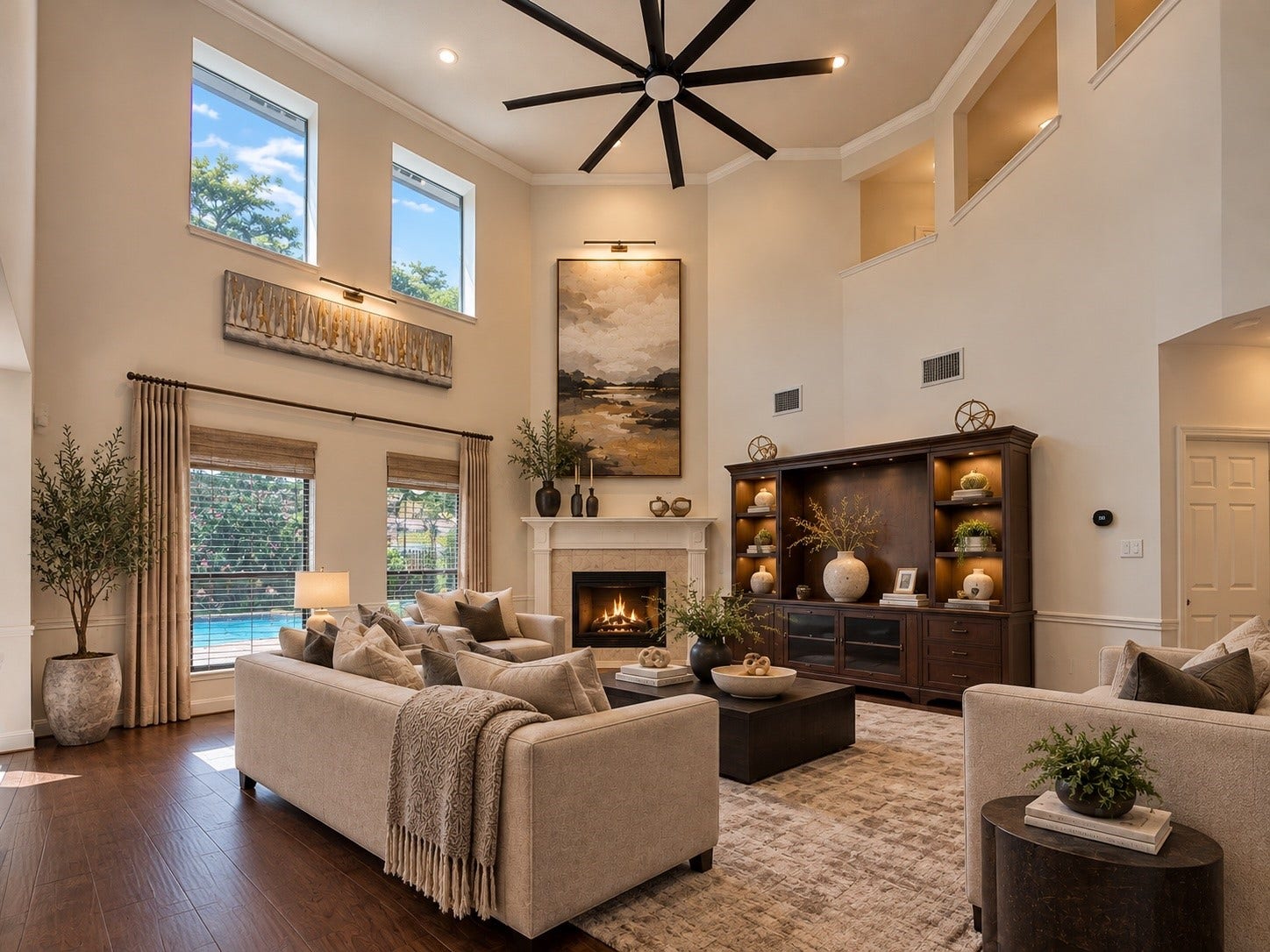 2602 Falcon Knoll Lane, Katy, TX 77494 Expansive family room showcasing soaring ceilings, a dramatic wall of windows, and a cozy gas fireplace. VS