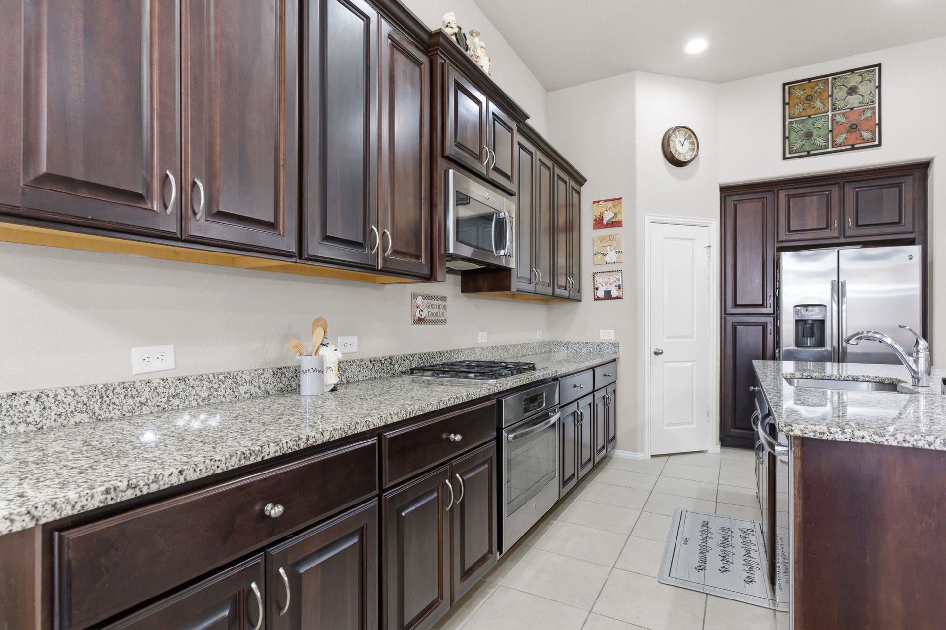 Beautiful kitchen features granite counter tops and massive kitchen island perfect for family gatherings!
