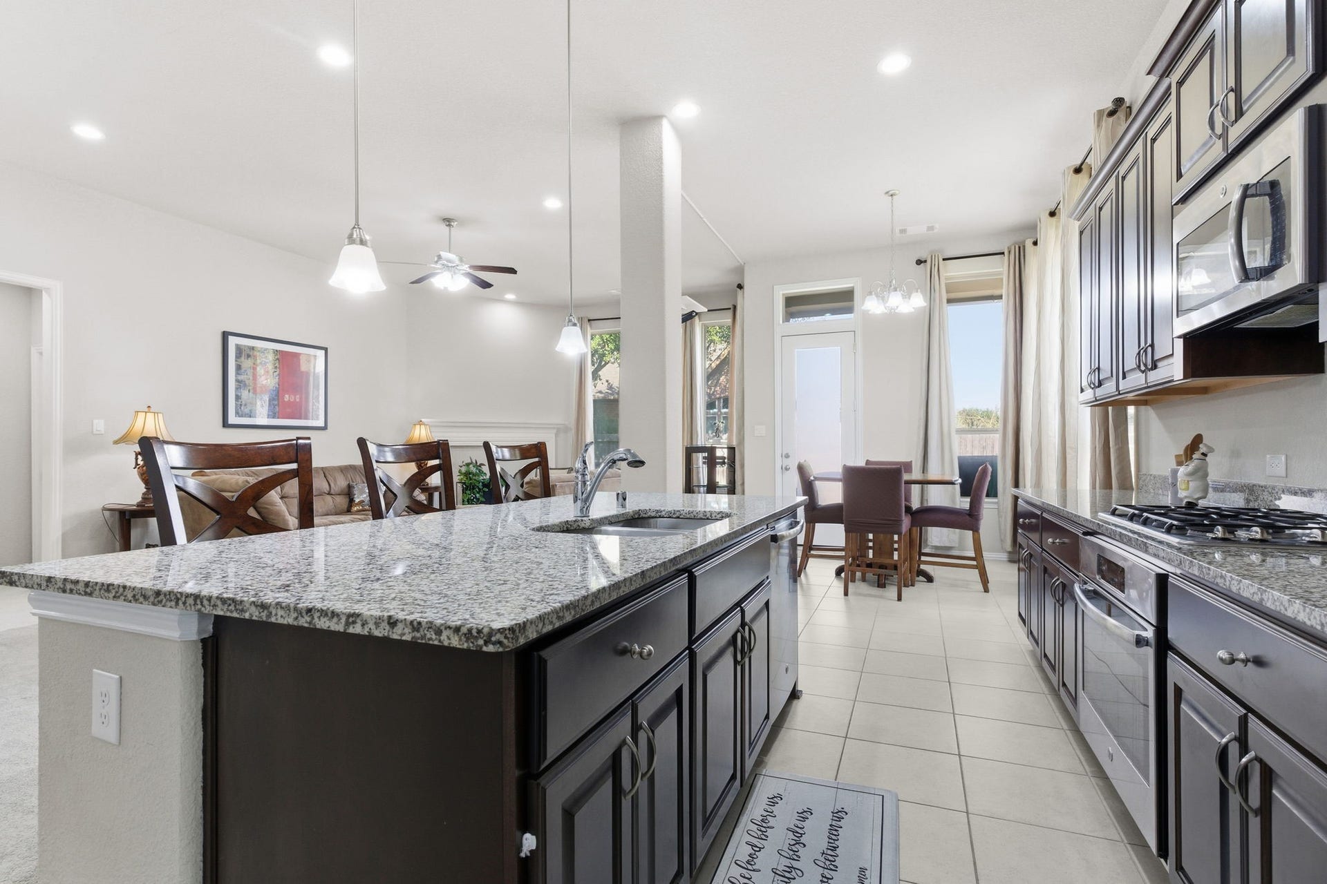 View from large pantry showcases open concept with tons of ambient lighting!
