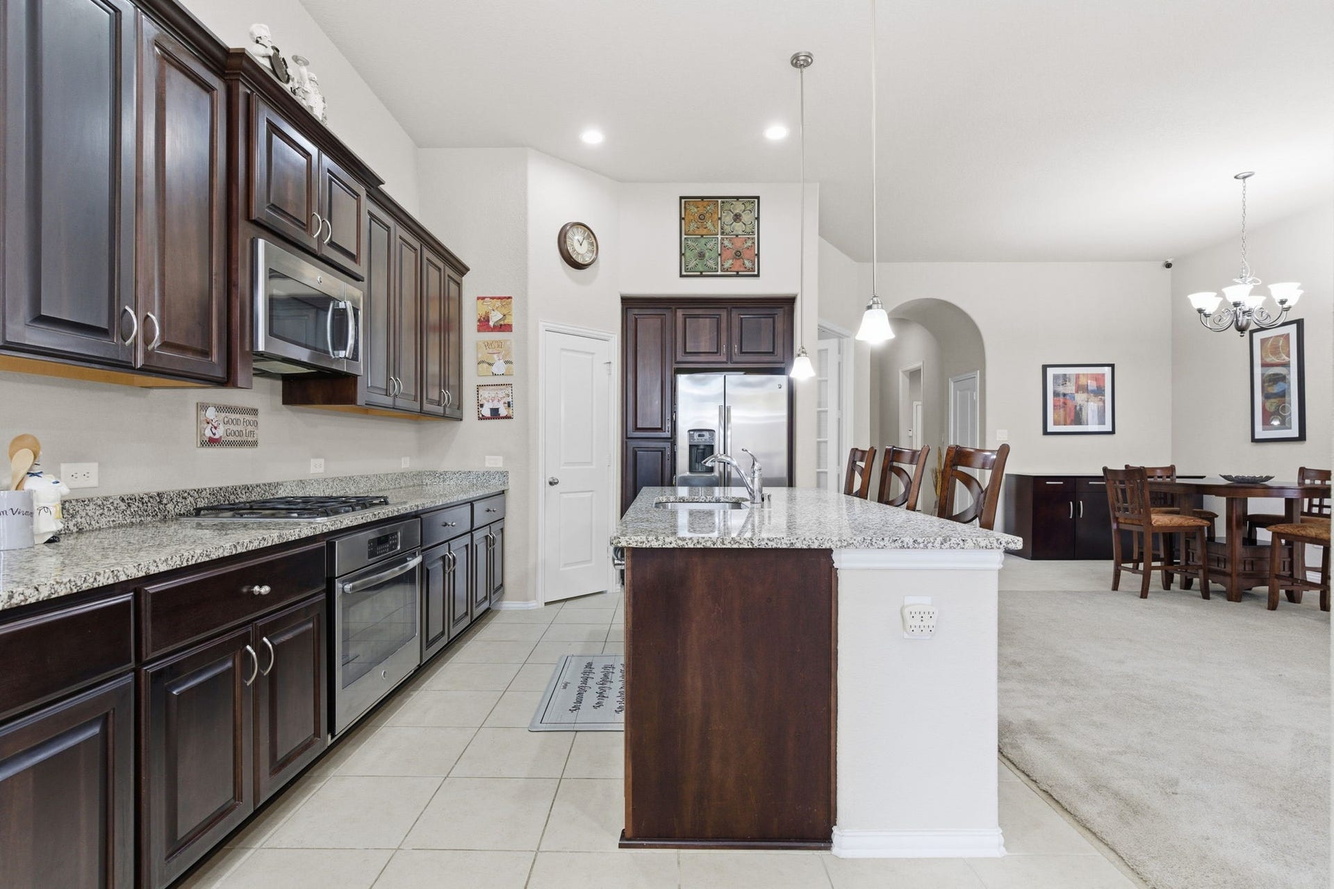 Beautiful kitchen features granite counter tops and massive kitchen island perfect for family gatherings!