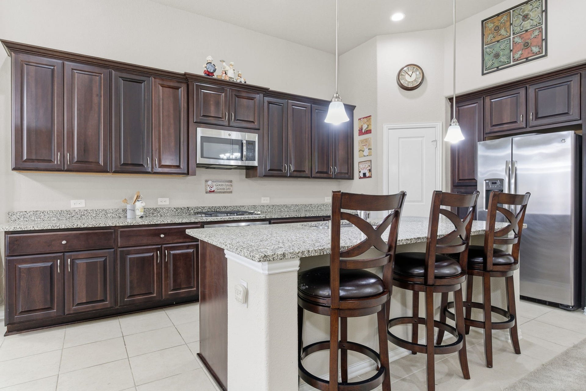 Beautiful kitchen features granite counter tops and massive kitchen island perfect for family gatherings!