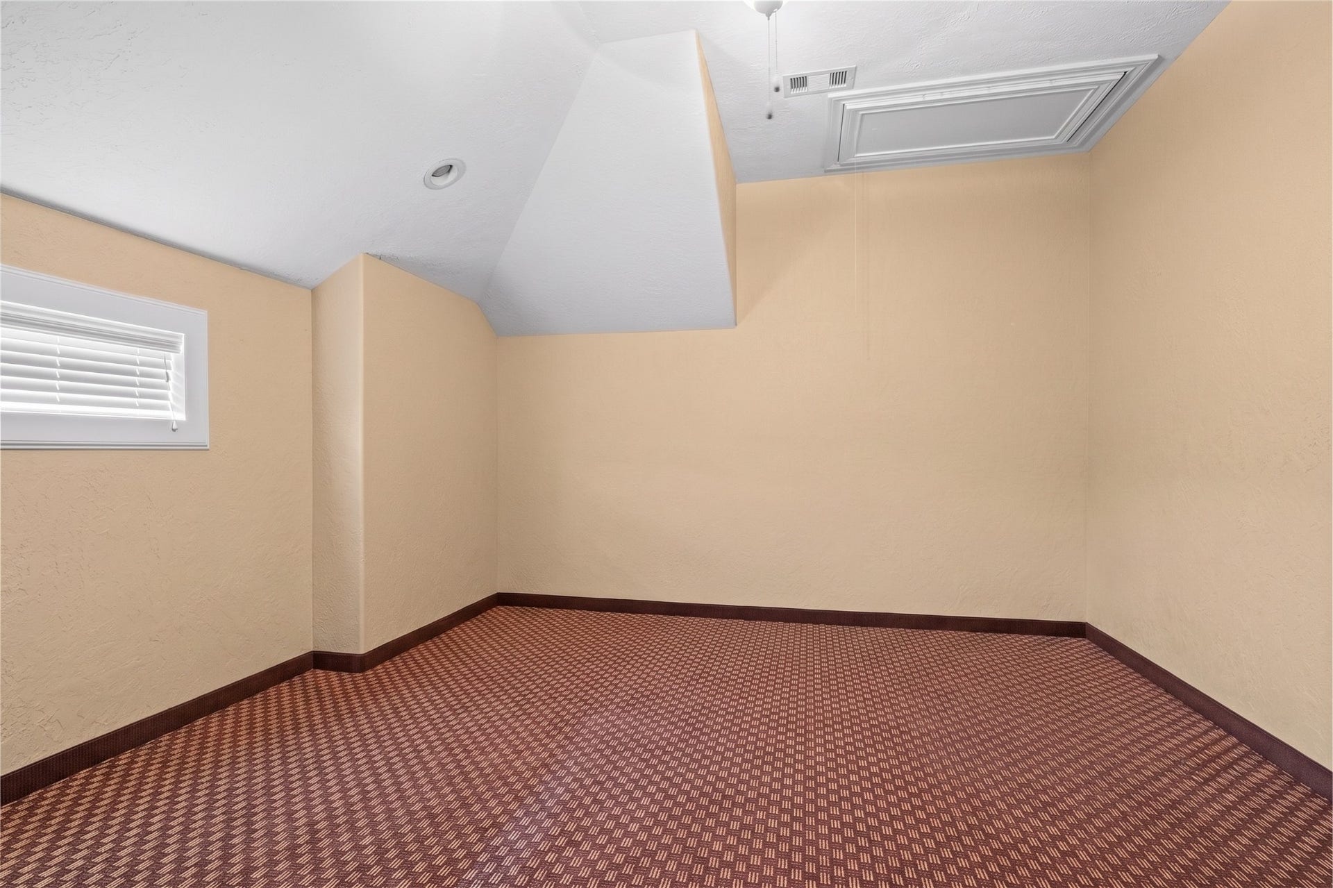 Versatile bonus room offering generous space and flexibility for recreation, hobbies, or additional storage.