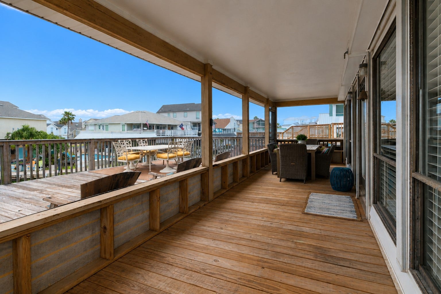 The entry to the home brings the inside out with a covered area to dine alfresco.