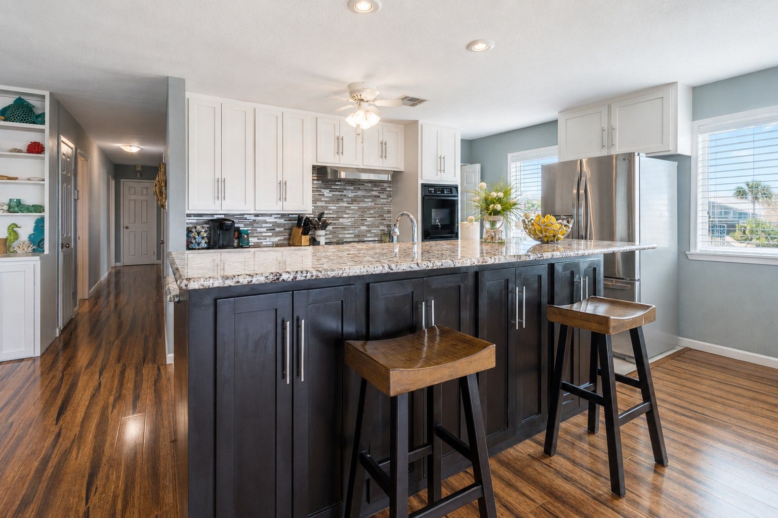 Breakfast bar with  cabinets below allow for extra storage.