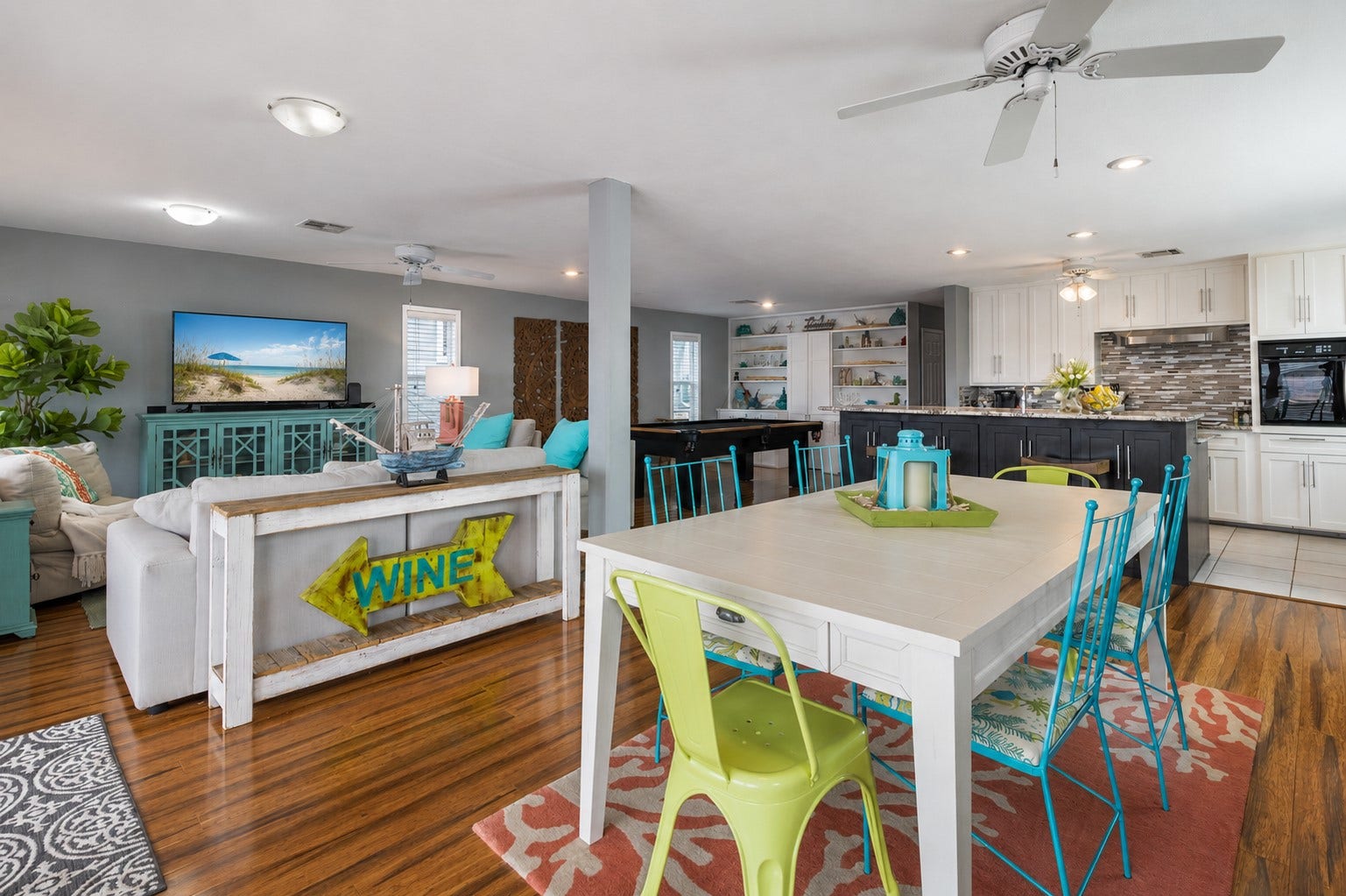 This open floorplan view flows into the living, dining and kitchen spaces.