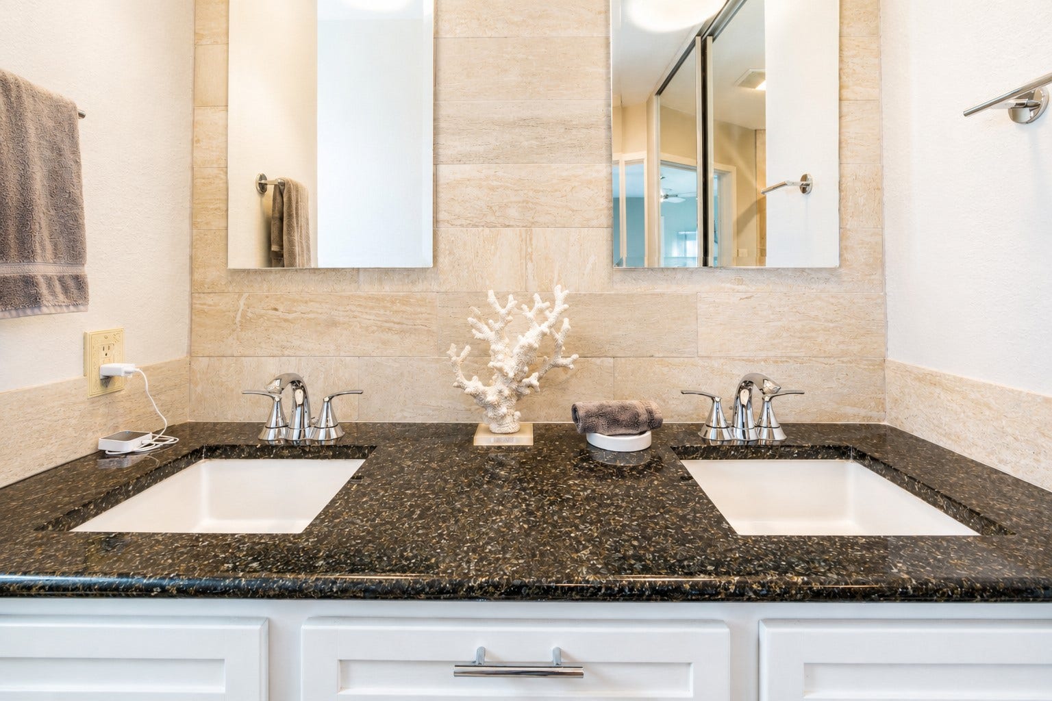Primary ensuite offers updated double sinks and vanity.