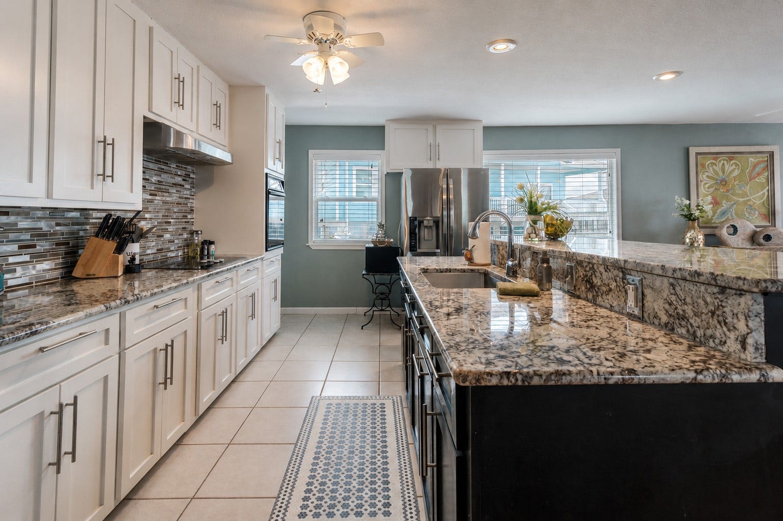 Updated countertops offer multiple work spaces.