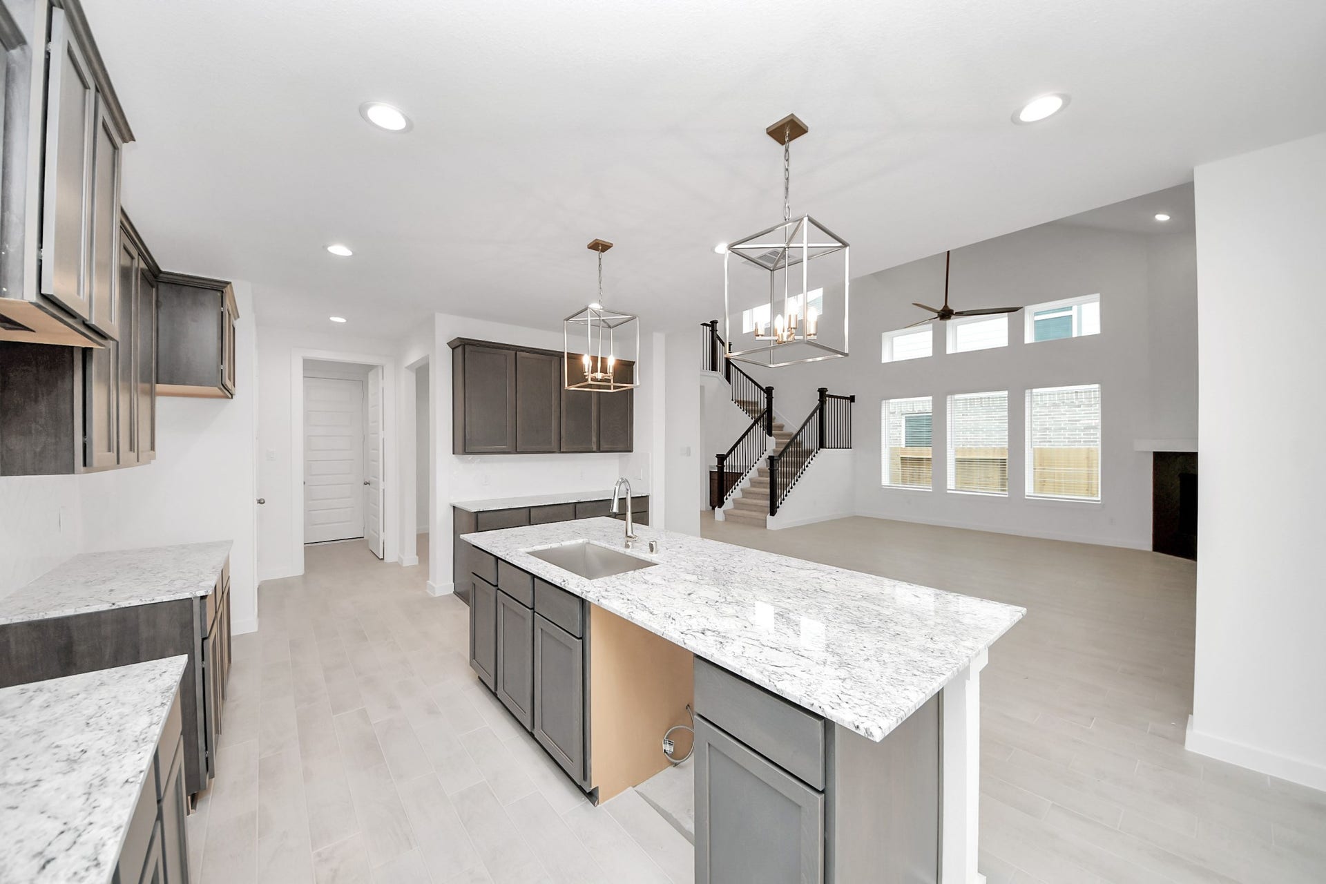 24515 Broad Park Ct, Spring, TX 77373 This kitchen is by far any chefs dream! This spacious kitchen features high ceilings, stained wood cabinets, granite countertop, SS appliances, modern tile backsplash, recessed lighting, extended counter space, granite kitchen island with double sink, and space for breakfast bar, and a walk-in pantry all overlooking your huge family room.
