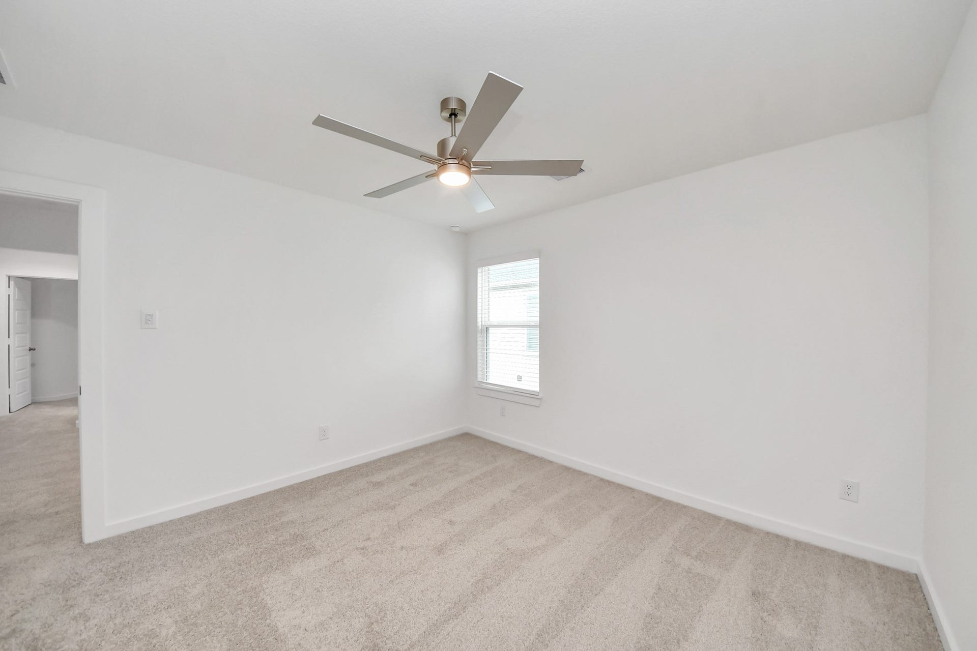 24515 Broad Park Ct, Spring, TX 77373 Generously sized secondary bedrooms featuring spacious closets, soft and inviting carpeting underfoot, large windows allowing plenty of natural light, and the added touch of privacy blinds for your personal retreat.