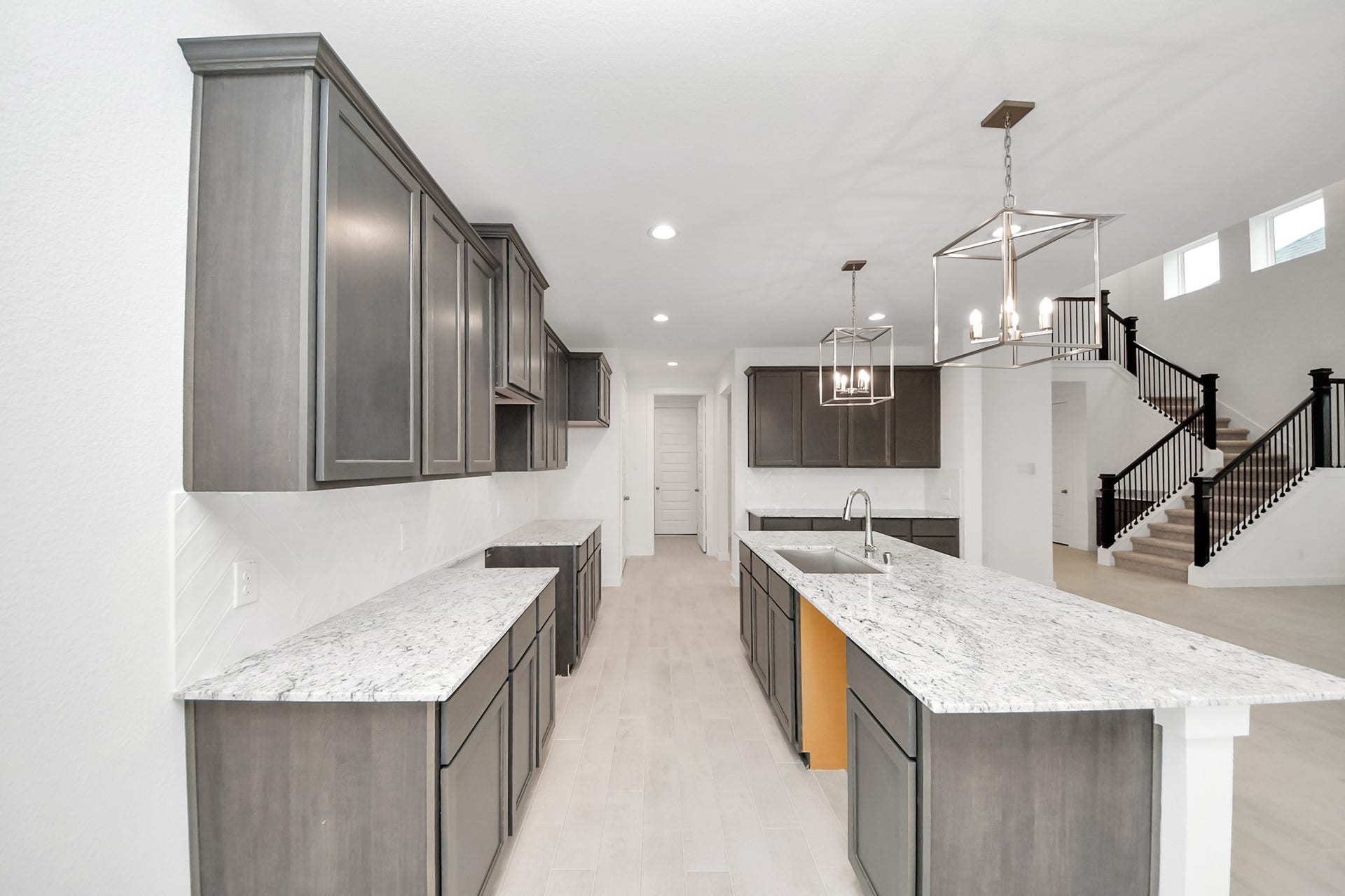 24515 Broad Park Ct, Spring, TX 77373 The open concept effortlessly connects the kitchen to the expansive family room, forming a perfect hub for gatherings. This seamless flow creates an inviting space where cooking and socializing come together harmoniously.