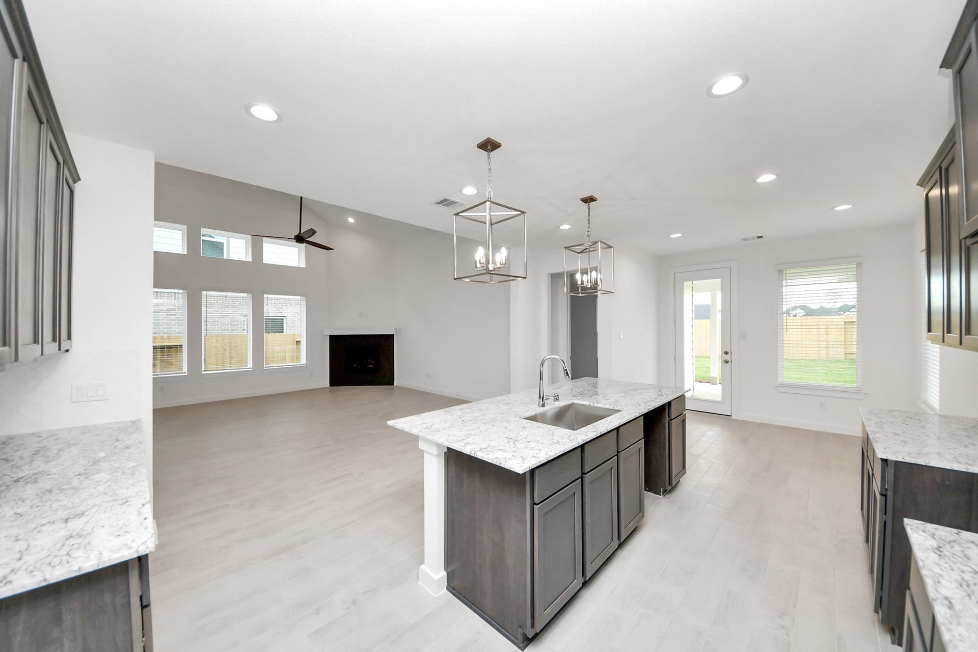 24515 Broad Park Ct, Spring, TX 77373 The extended counter area adds both practicality and style, making meal preparation a breeze. Every detail is thoughtfully designed to enhance the kitchen's functionality and aesthetic appeal.
