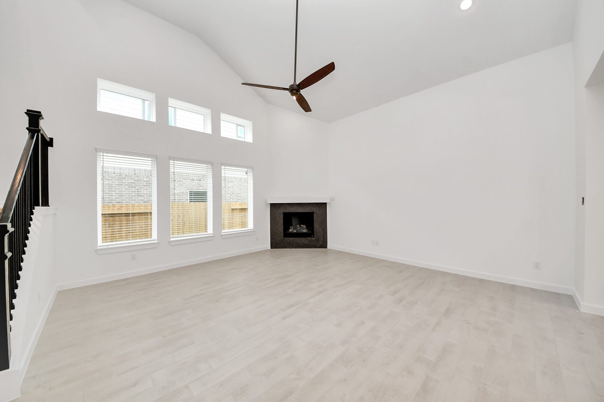 24515 Broad Park Ct, Spring, TX 77373 Welcome family and guests to your charming living room! With its high ceilings, recessed lighting, ceiling fan, custom paint, beautiful flooring, and large windows that let in abundant natural light, this room is perfect for gatherings.