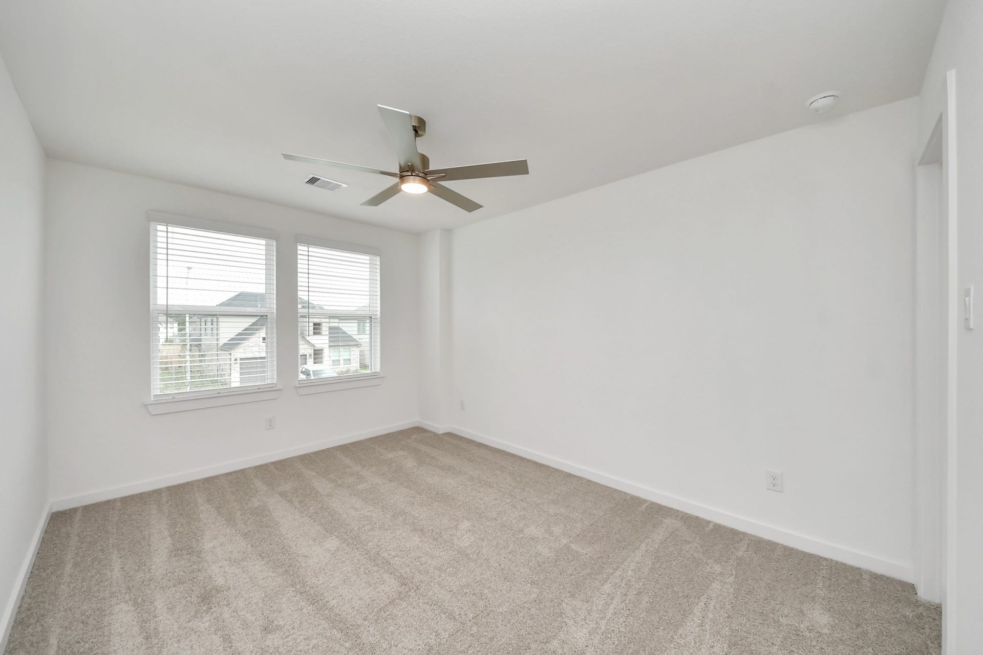 24515 Broad Park Ct, Spring, TX 77373 Generously sized secondary bedrooms featuring spacious closets, soft and inviting carpeting underfoot, large windows allowing plenty of natural light, and the added touch of privacy blinds for your personal retreat.
