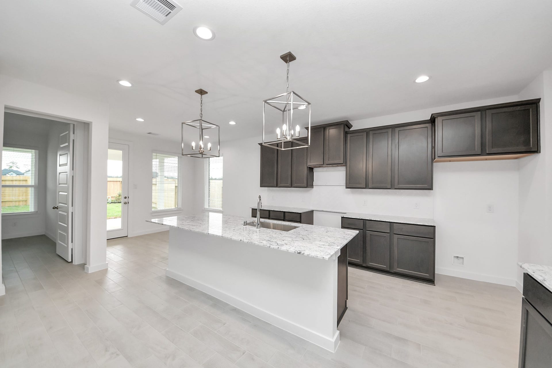 24515 Broad Park Ct, Spring, TX 77373 All of this overlooks your expansive family room, creating a perfect space for culinary delights and family gatherings.
