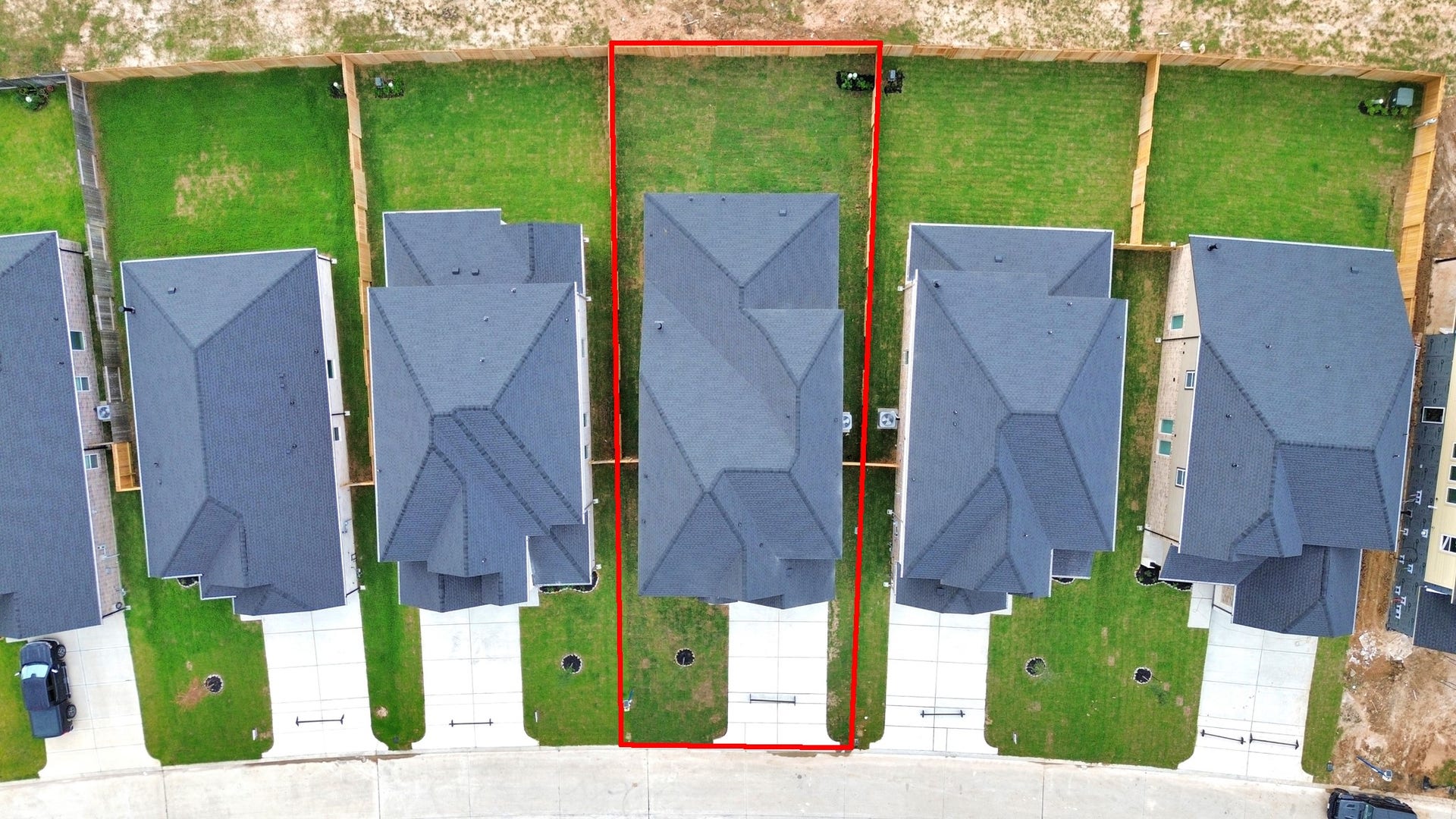 24515 Broad Park Ct, Spring, TX 77373 An aerial view of a spacious subdivision lot, highlighting a well-maintained yard and a fully fenced perimeter, offering both privacy and expansive outdoor space.