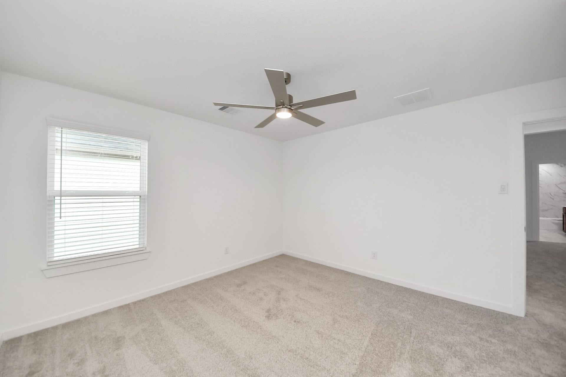 24515 Broad Park Ct, Spring, TX 77373 Generously sized secondary bedrooms featuring spacious closets, soft and inviting carpeting underfoot, large windows allowing plenty of natural light, and the added touch of privacy blinds for your personal retreat.