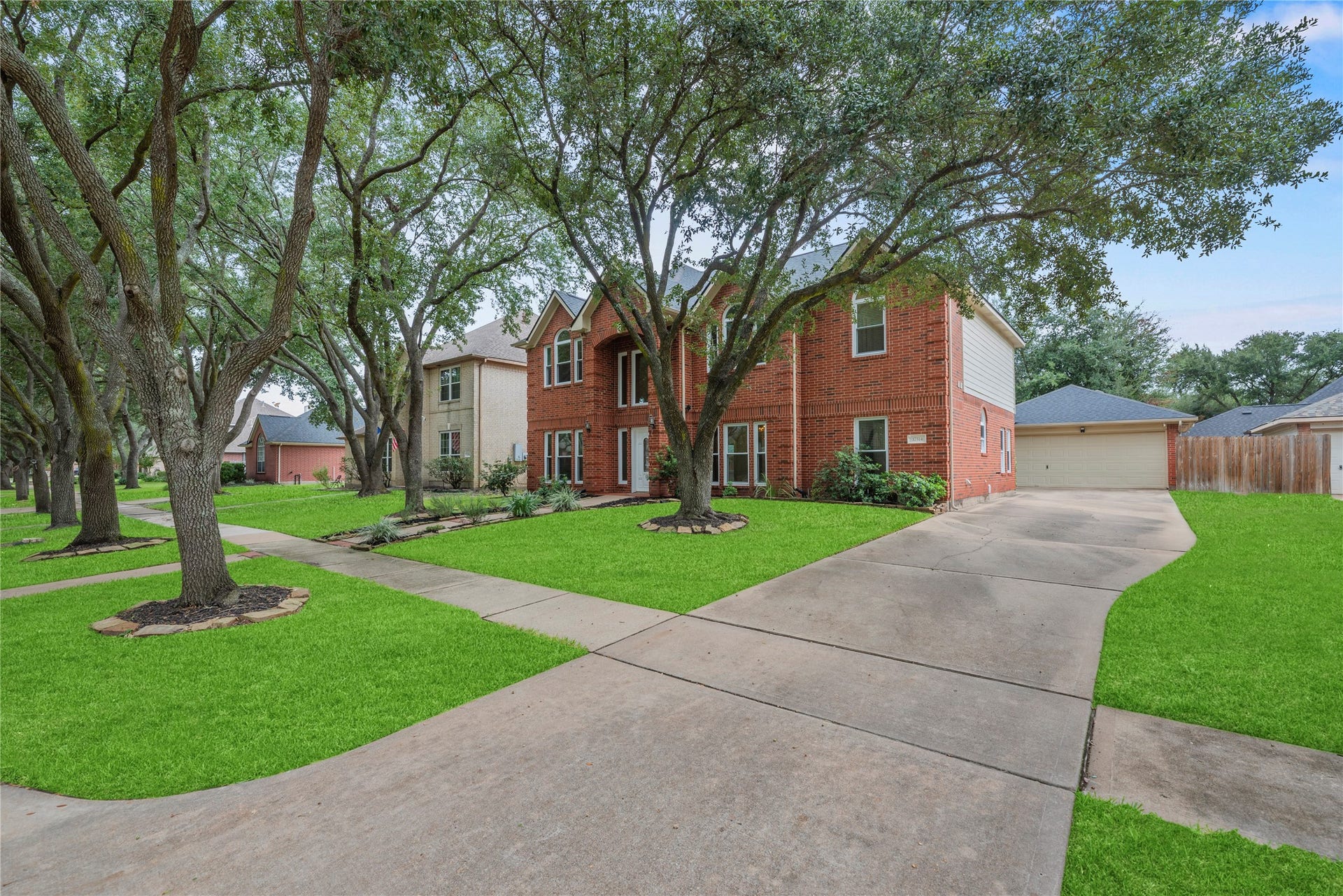 Long driveway and detached 2-car garage provide plenty of parking.