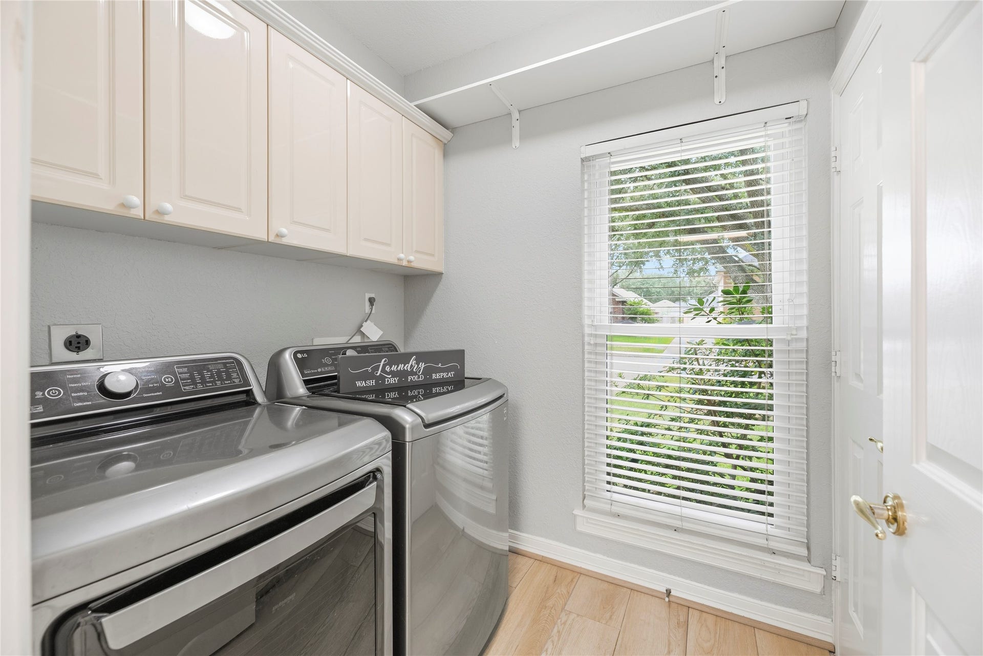 Utility room has additional storage.