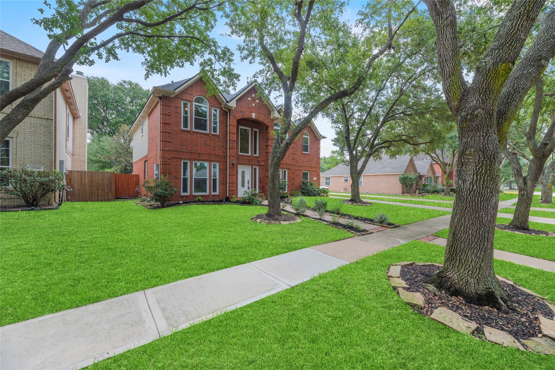 Lovely brick elevation and mature trees create great curb appeal.