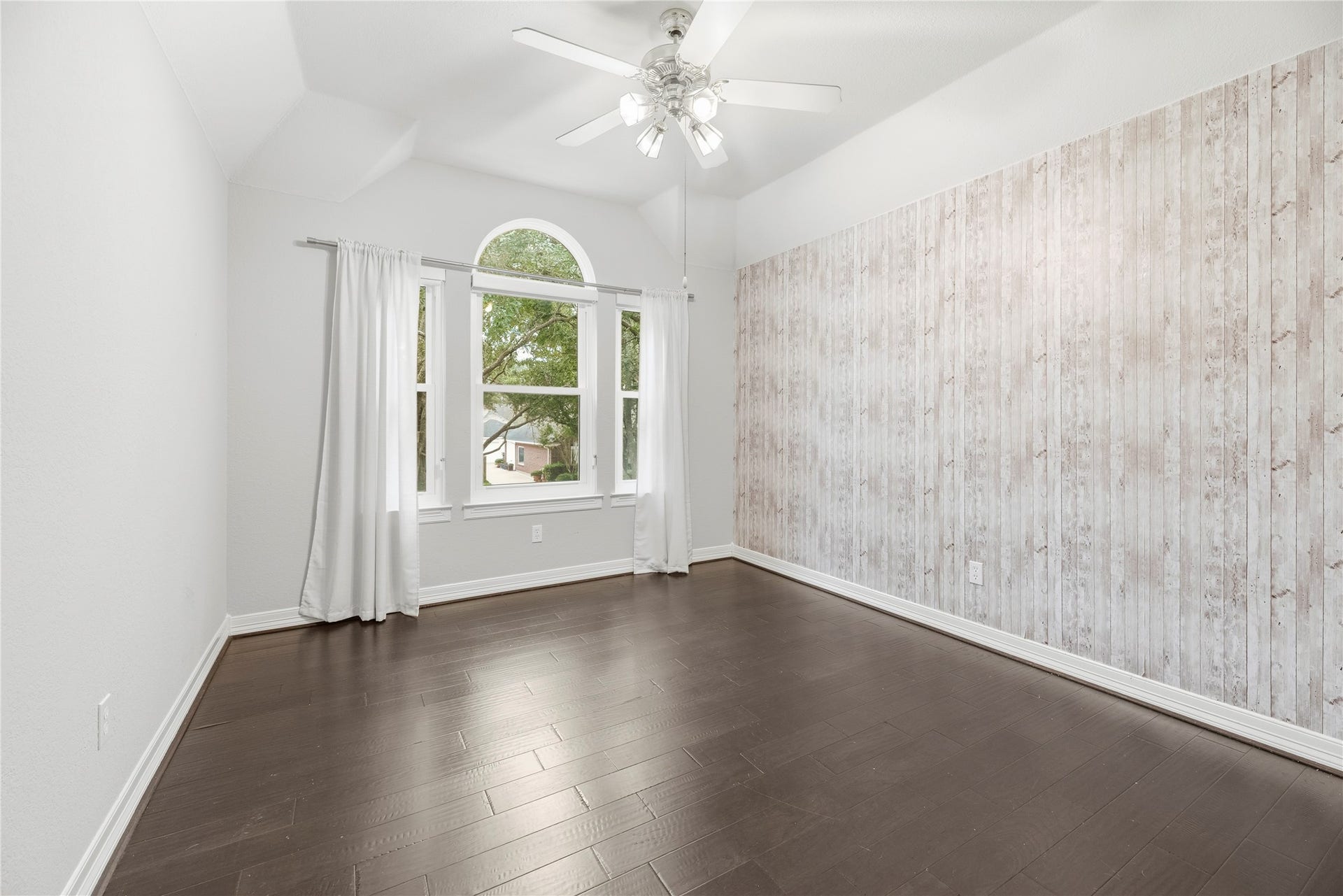 Upstairs bedroom with a beautiful accent wall.