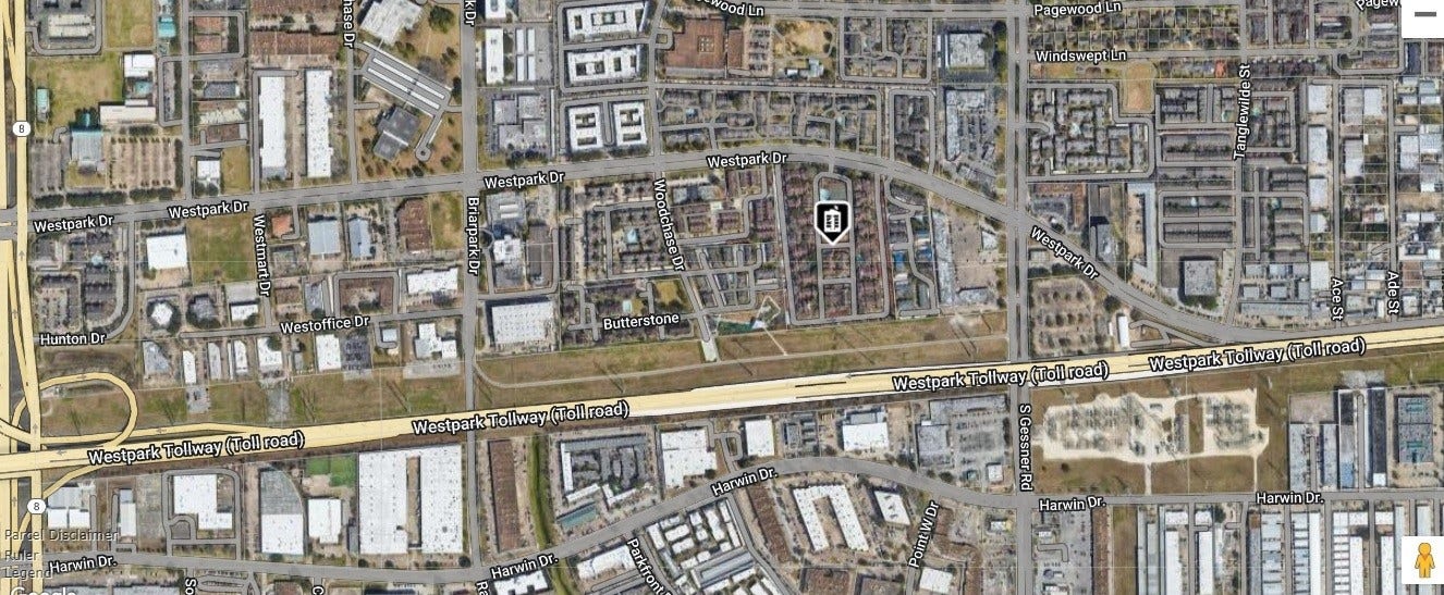 10049 Westpark Drive, #136, Houston, TX 77042 This aerial view shows a residential area with a mix of homes and commercial buildings. It's located near the Westpark Tollway, providing convenient access to major roads. The neighborhood has a grid layout with nearby amenities and green spaces.