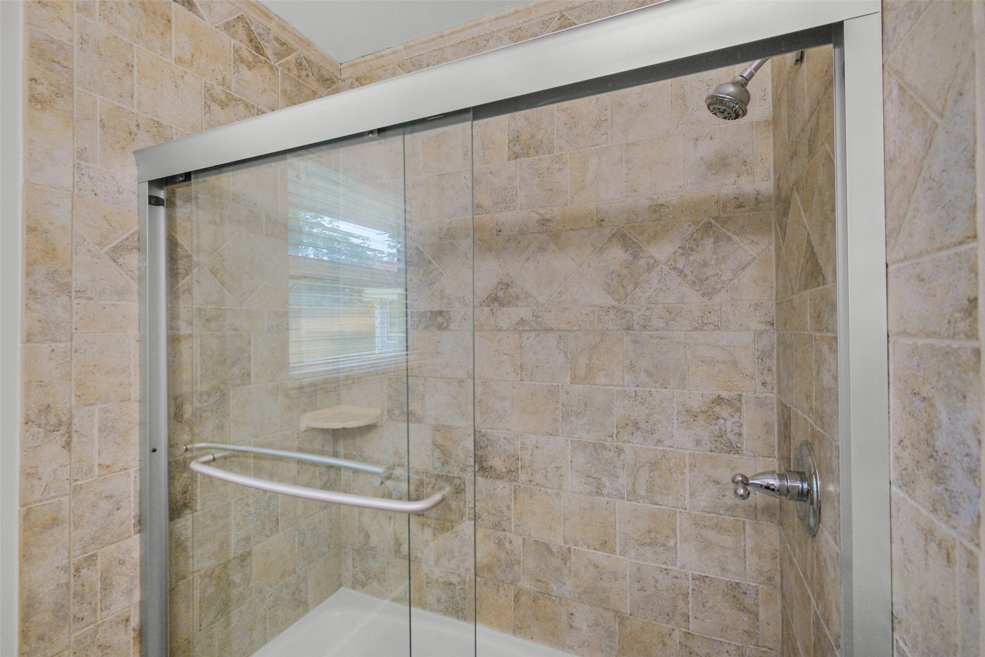 1710 Willowby Drive, Houston, TX 77008 Updated glass enclosed bath/shower serving second bedroom.