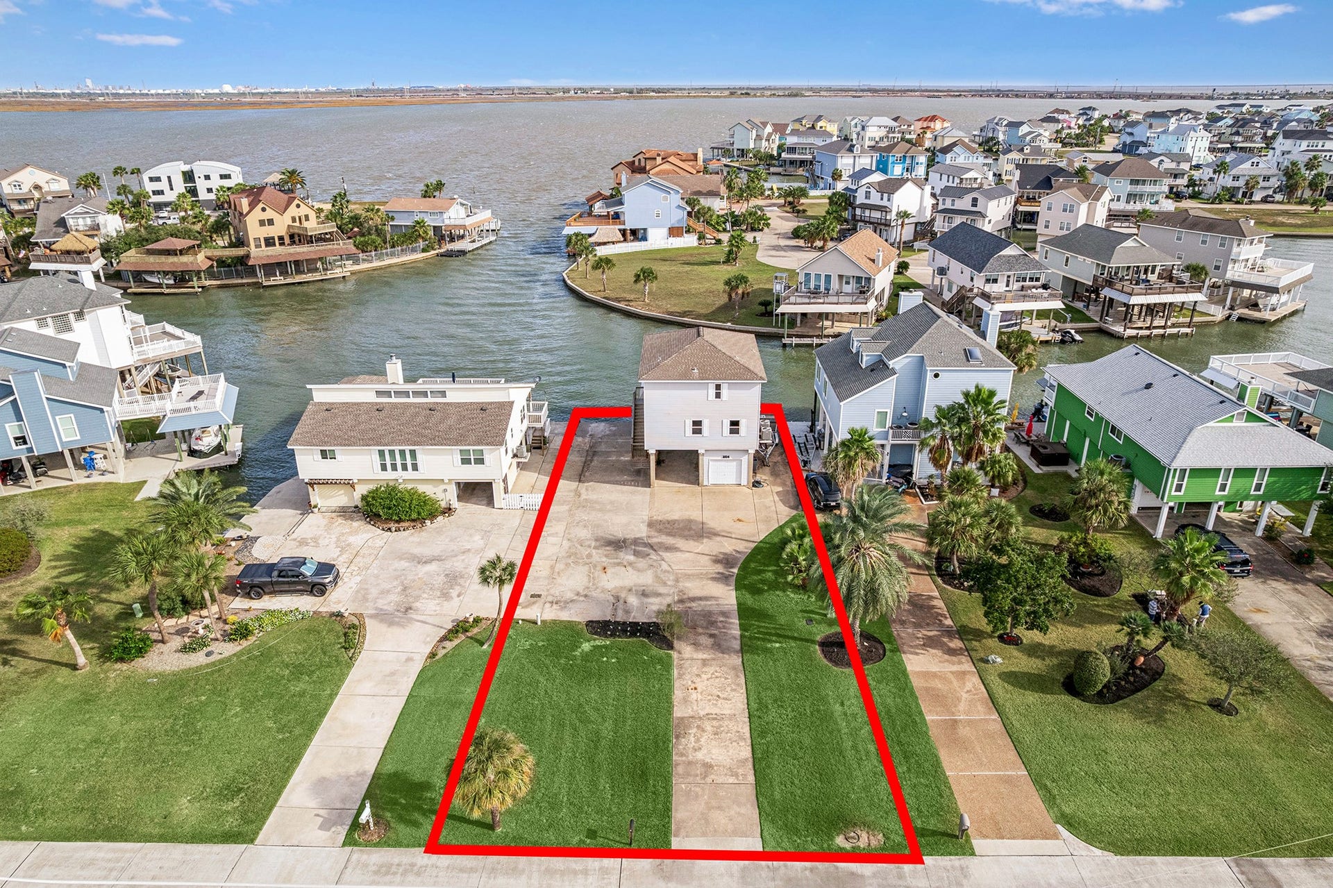 1814 Tiki Drive, Tiki Island, TX 77554 Discover your dream home on a spacious lot with stunning waterfront views, perfect for creating lasting memories and endless possibilities.