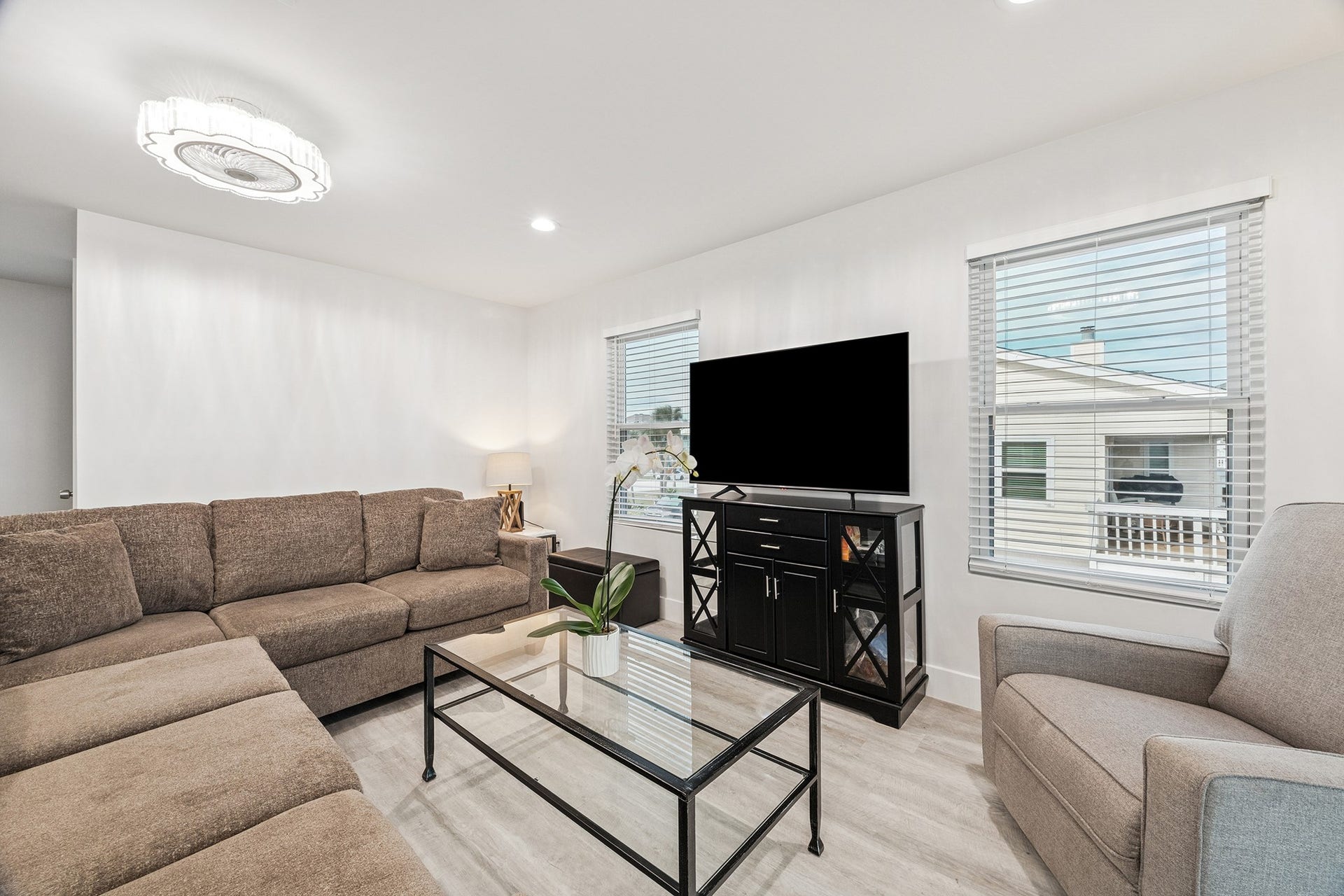 1814 Tiki Drive, Tiki Island, TX 77554 Experience the inviting warmth of this light-filled living space, perfect for bright and modern living.