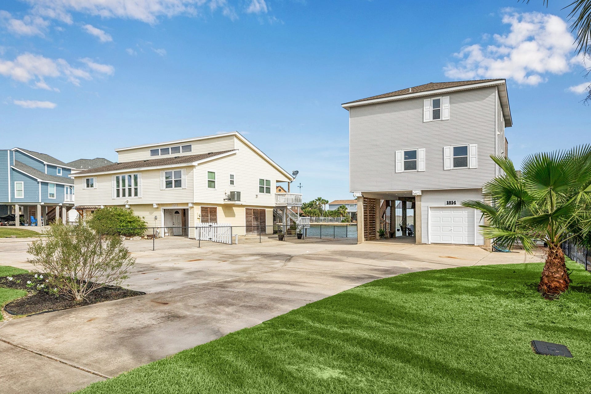 1814 Tiki Drive, Tiki Island, TX 77554 This inviting property boasts ample parking and versatile outdoor space perfect for leisure activities offering both convenience and entertainment potential.