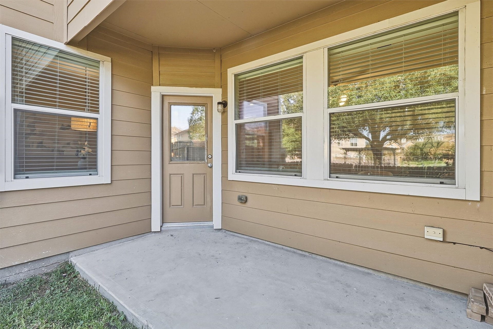 8323 Lamond Lane, Houston, TX 77095 Enjoy the outdoors on your covered patio! There's space for your grill and a small dining set.