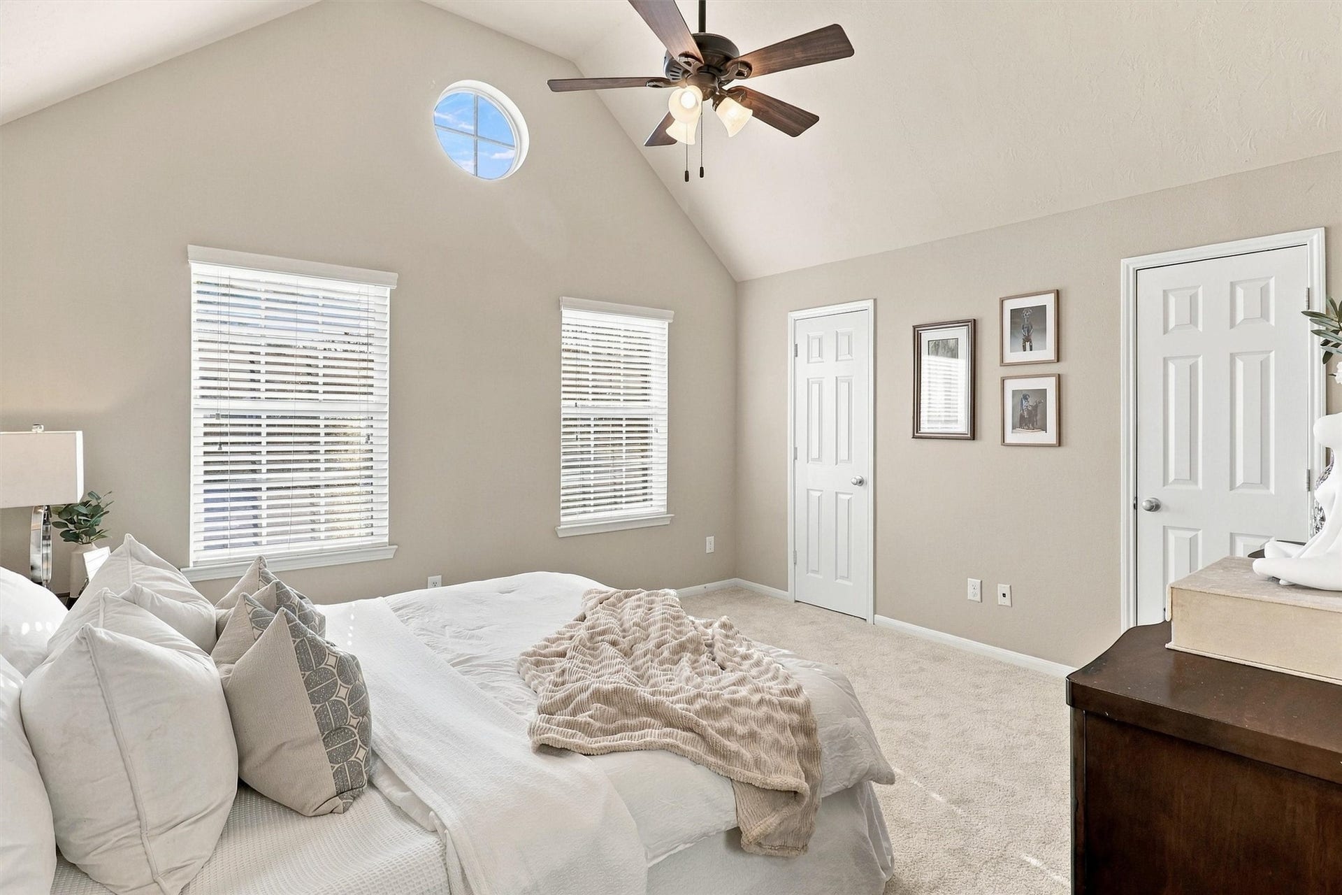 8323 Lamond Lane, Houston, TX 77095 Welcome to your primary retreat! This primary bedroom is filled with natural light. The room features NEW carpet in a timeless color, vaulted ceilings, 3 bright windows, ceiling fan, walk-in closet, and en suite bath.