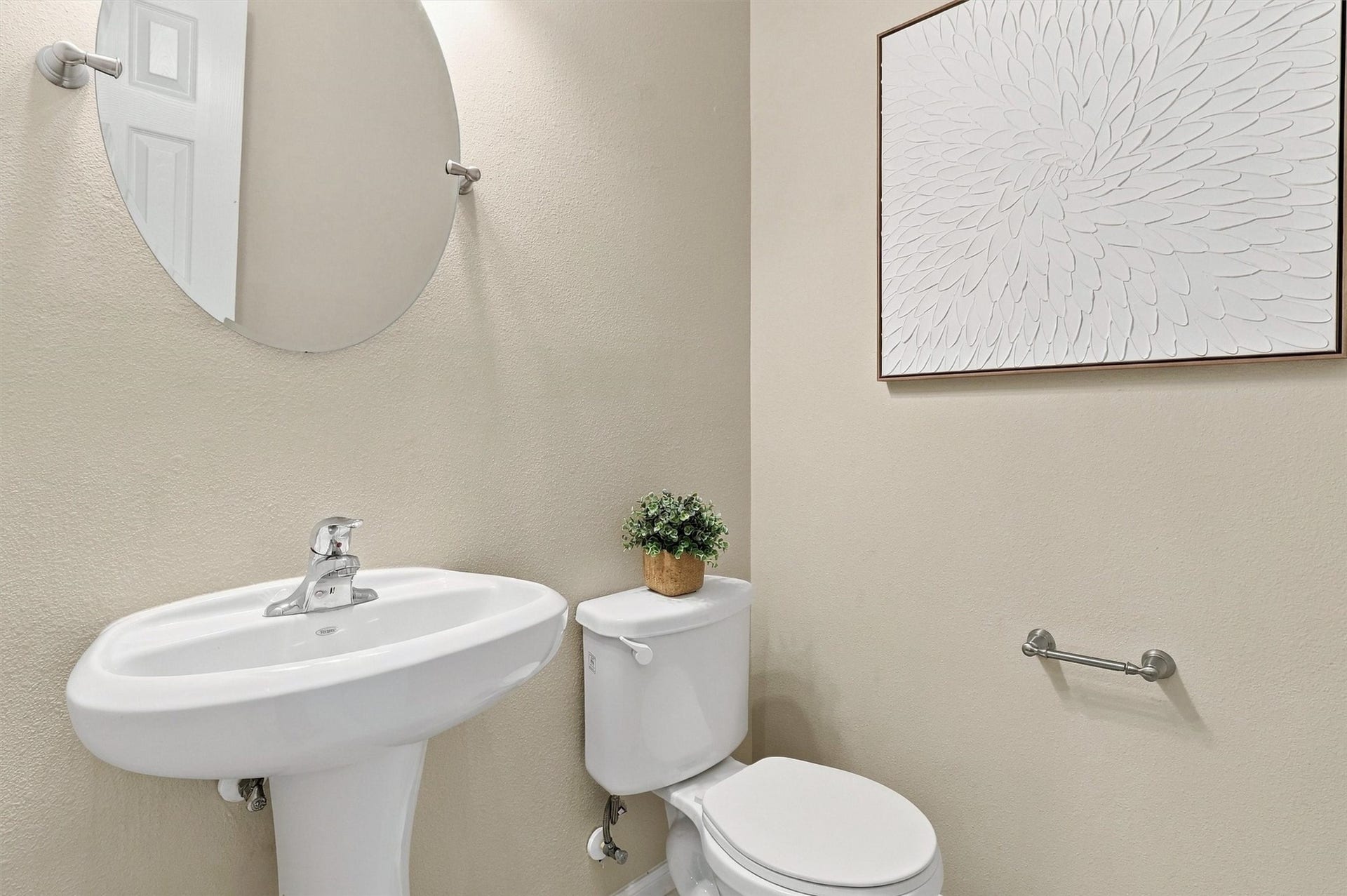 8323 Lamond Lane, Houston, TX 77095 The glittering half bath has been updated with hexagonal marble-look tile, a frameless mirror with brushed nickel finishes, updated lighting, and Sherwin Williams paint! It's another pocket of little luxuries!