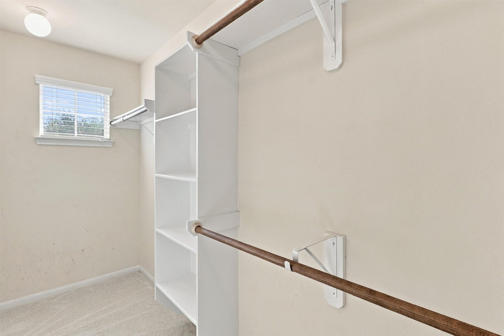 8323 Lamond Lane, Houston, TX 77095 The walk-in closet features built-in shelving, hanging racks, new carpet, and a petite window that lets natural light shine through. There is plenty of space for your clothes, shoes, accessories, and luggage!