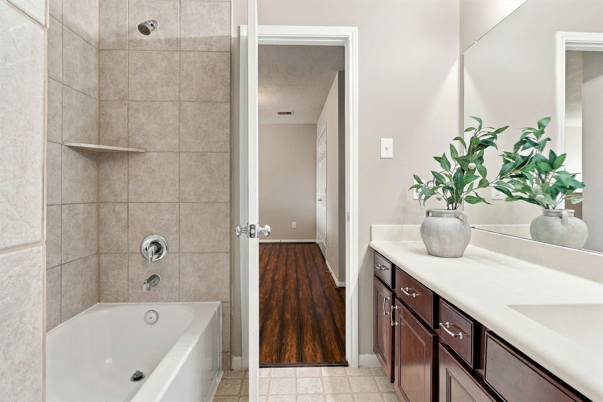 8323 Lamond Lane, Houston, TX 77095 Alternate view of the bathroom highlights the tile surround and glittering chrome finishes.