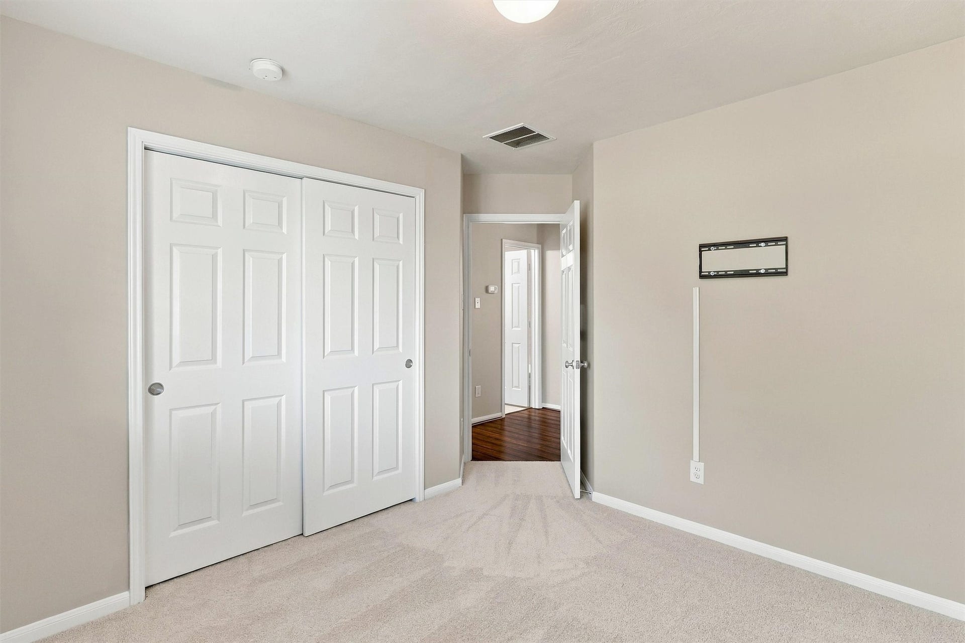 8323 Lamond Lane, Houston, TX 77095 Double doors slide to reveal a deep reach in closet.