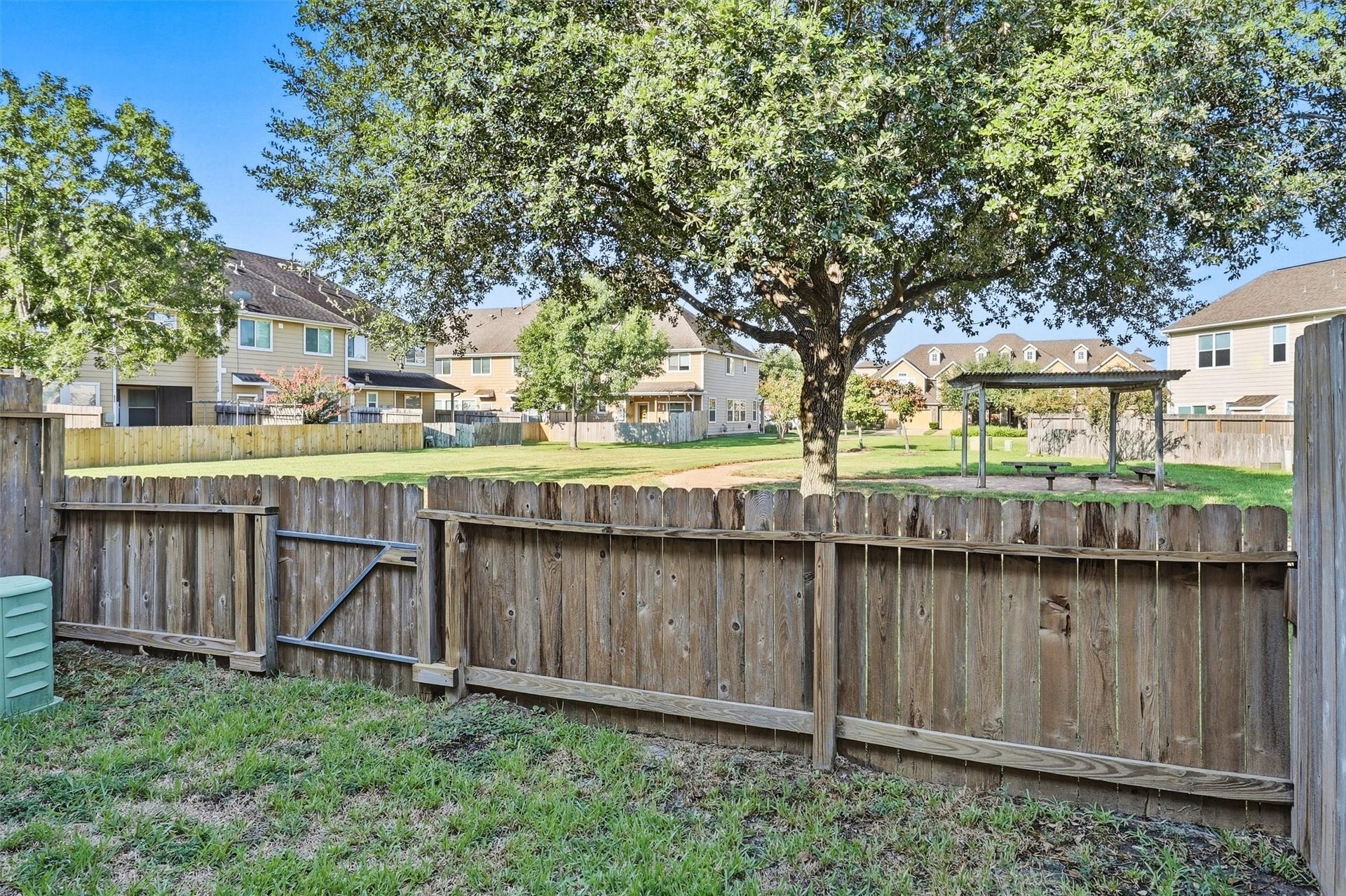 8323 Lamond Lane, Houston, TX 77095 The half-height fence at the back of the townhome offer views of the wooded and serene community park! Note the pergola and picnic table just outside your gate. Low maintenance living, low insurance, and low property taxes are waiting for you at 8323 Lamond!