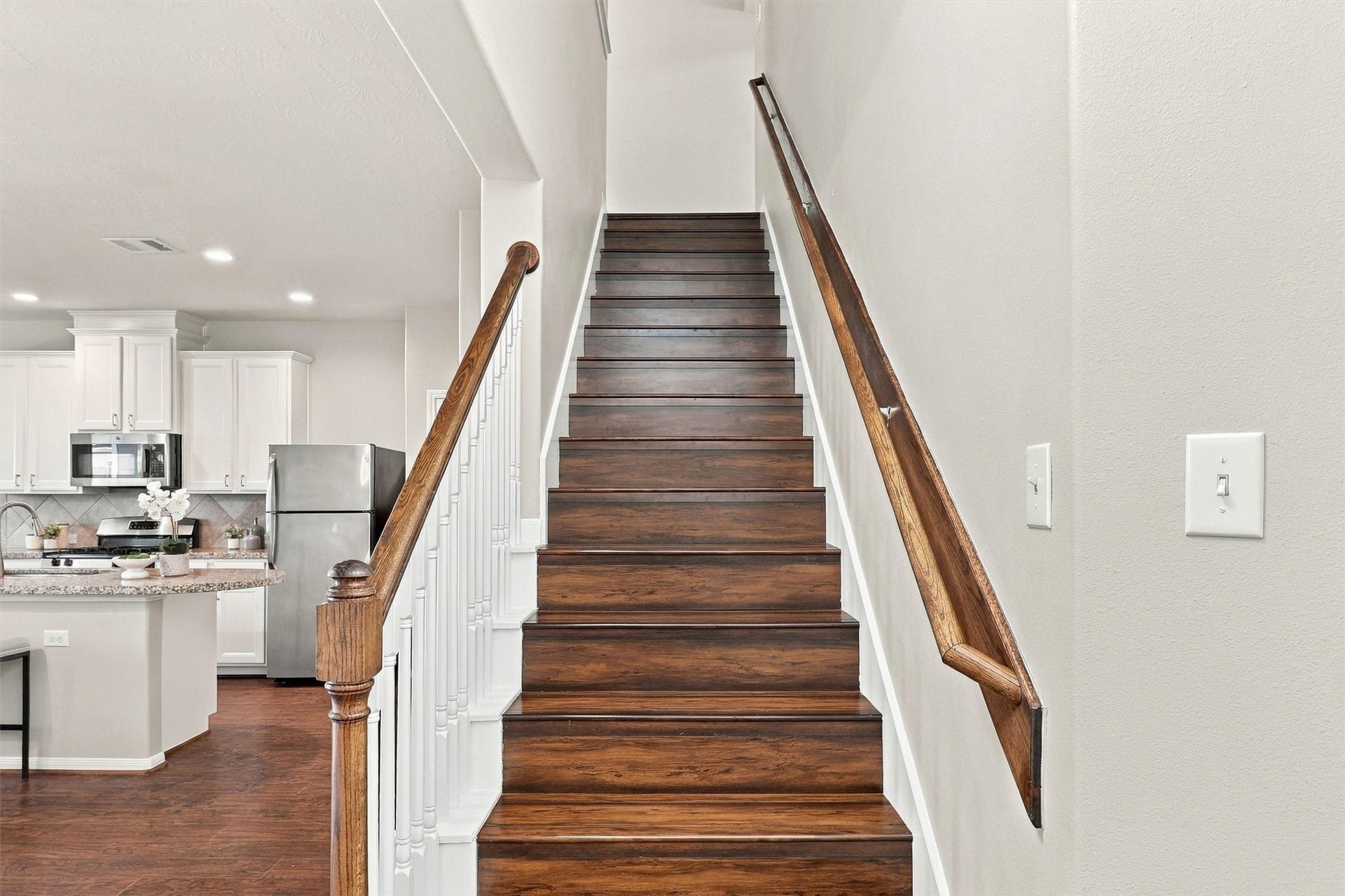 8323 Lamond Lane, Houston, TX 77095 Travel upstairs to find 3 bedrooms, 2 full baths, a game room and laundry area! Note the elevated treads and risers with crisp white trim and balusters!