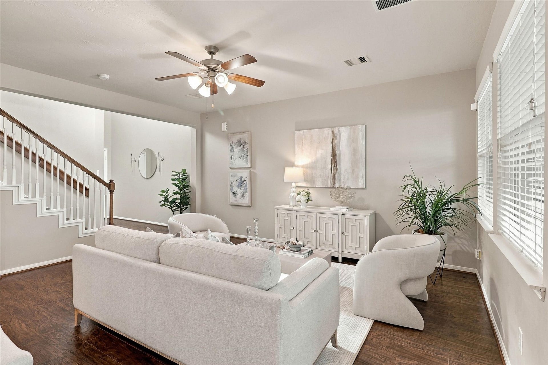 8323 Lamond Lane, Houston, TX 77095 The living room features upgraded Sherwin Williams paint, wood laminate floors in a rich walnut color, crisp white trim, ceiling fan, and windows that let natural light flow through. There is plenty of space to set up your couch and occasional chairs. The room is wired for cable and internet so that you can set up your media console on the longest wall.