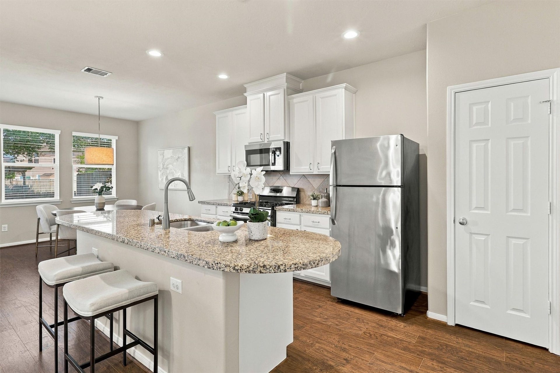 8323 Lamond Lane, Houston, TX 77095 Welcome to your PRISTINE and elevated kitchen! The cabinets are in perfect condition and are painted a soft white with top quality Sherwin Williams Paint. Note the granite counters, recessed lighting, tile backsplash, undermount sink, and brushed nickel finishes that complement the stainless steel appliances. The cabinets are upgraded with a staggered elevation, crown molding, and nickel cabinet pulls.