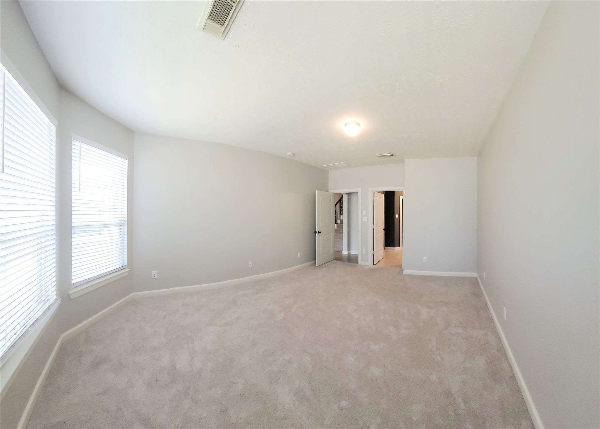 12638 Ember Village Lane, Tomball, TX 77377 Primary bedroom looking toward the bathroom and entrance