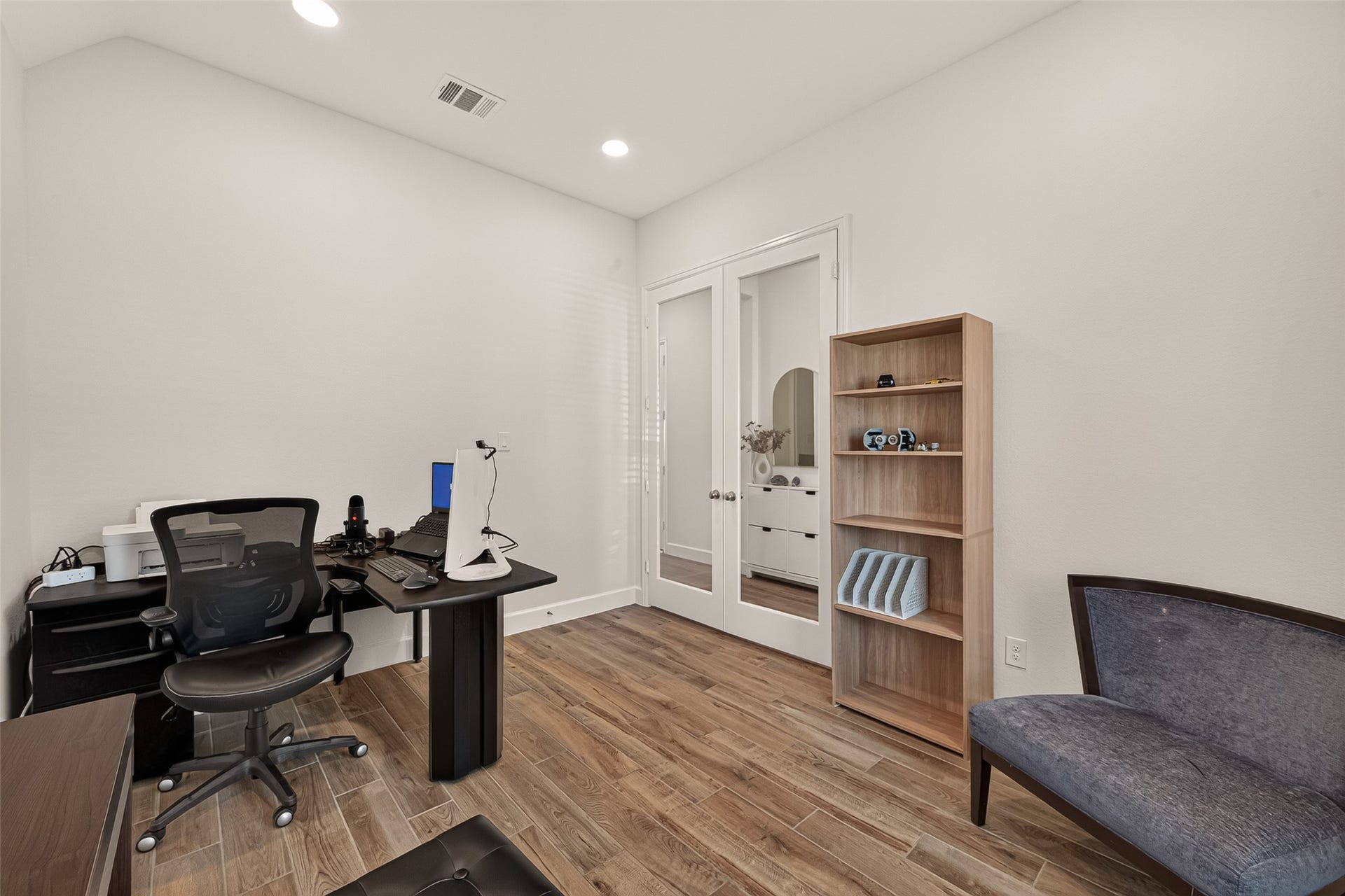 24111 Avocet Creek Road, Katy, TX 77493 The office/studio is expansive enough to accommodate furniture arrangements; The light coming through the glass French doors is the perfect element for this office/studio.