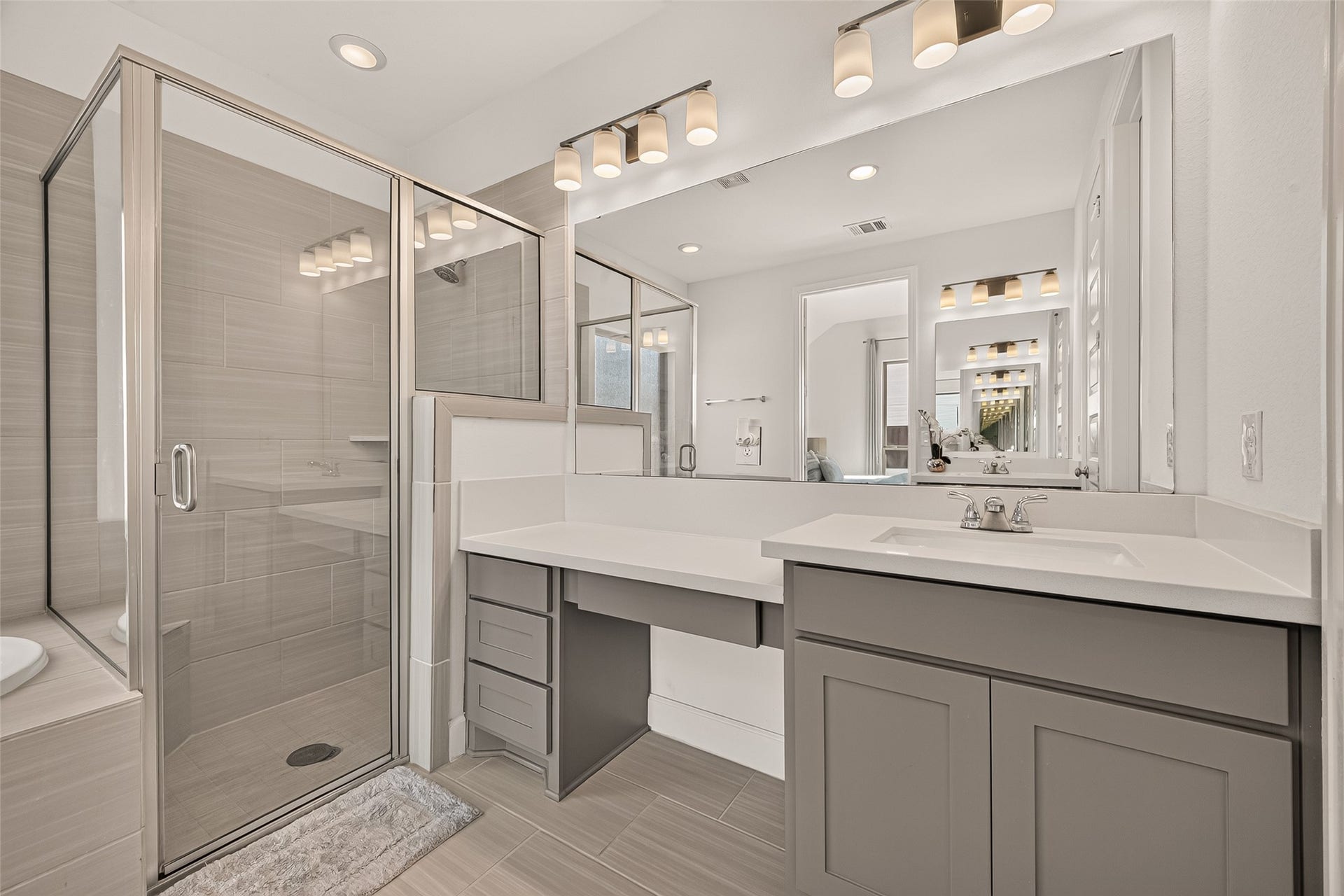 24111 Avocet Creek Road, Katy, TX 77493 The separated shower and tub provide versatility and convenience, while the separate double sink cabinets with lots of storage space offers functionality without compromising on style.