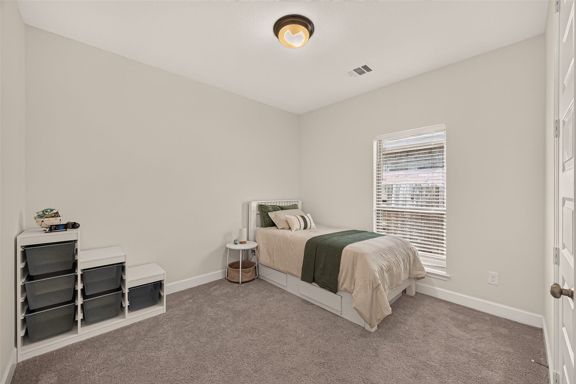 24111 Avocet Creek Road, Katy, TX 77493 With its thoughtful layout and stylish design, this secondary bedroom offers the perfect retreat for rest and relaxation.