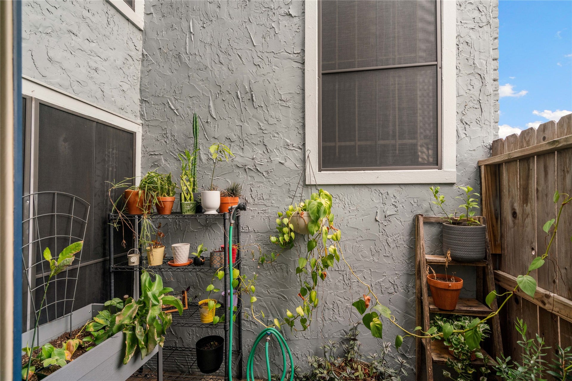 3200 S Gessner Road, #336, Houston, TX 77063 Privacy on the patio and solar screen to help with energy efficency.