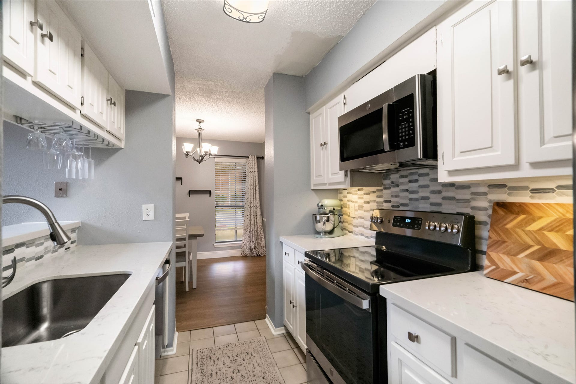3200 S Gessner Road, #336, Houston, TX 77063 kitchen updated with new backsplash and granite countertops.