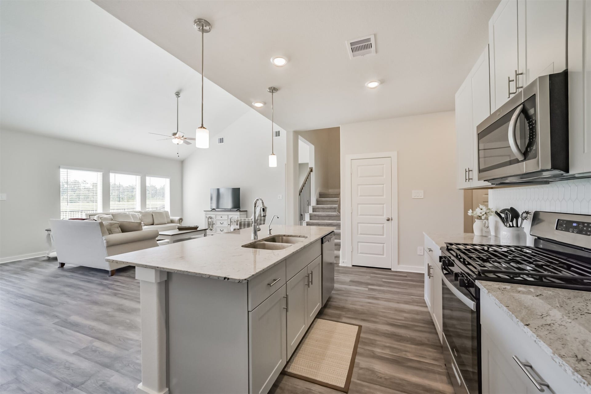 2630 Wastelbread Lane, Rosenberg, TX 77471 Kitchen with Pendent Lighting and Ceiling Fan in Living